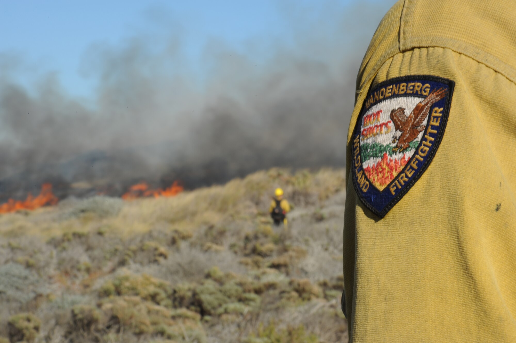 VANDENBERG AIR FORCE BASE, Calif. -- Firefighters from the 30th Civil Engineer Squadron watch the direction of a fire during a controlled burn to help enlarge the habitat for an endangered species of Western Snowy Plovers here Nov. 6.  (U.S. Air Force photo/Airman 1st Class Andrew Satran)
