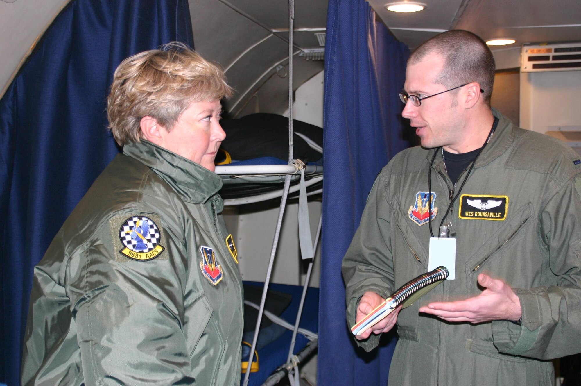 Oklahoma Lt. Gov. Jari Askins listens to the passenger brief from 1st Lt. Wes Rounsaville, air battle manager, 963rd Airborne Air Control Squadron, before her orientation flight on the E-3 Sentry Wednesday. The 552nd Air Control Wing is responsible for the operations, maintenance, logistics, training and combat support of E-3 Sentry AWACS aircraft and combat-ready Control and Reporting Centers in support of combatant commanders. The wing provides combat-ready theater battle management forces at the direction of the Chairman of the Joint Chiefs of Staff. It operates and supports these forces worldwide ensuring combat capability for all peacetime and contingency operations. (Air Force photo/1st Lt. Kinder Blacke)
