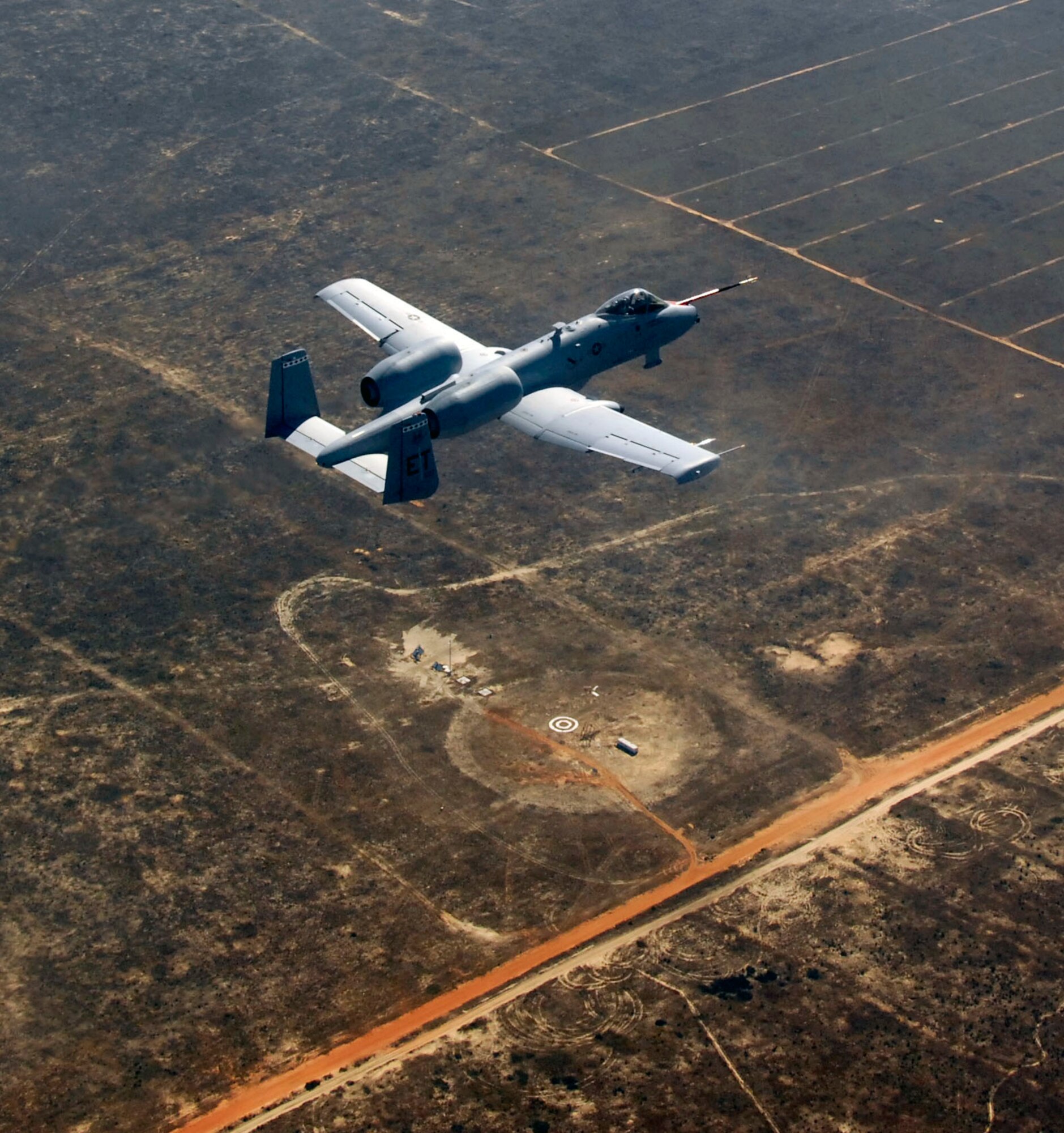 EGLIN AIR FORCE BASE, Fla. -- The A-10C Warthog, piloted by Maj. Matthew Domsalla, flies over what's left of the target. The Laser Joint Direct Attack Munition weapon was dropped off the A-10C for the first time on Nov. 5, successfully hitting its target and moving this weapons capability closer to fielding for warfighters. (US Air Force photo/ Master Sgt. Joy Josephson)