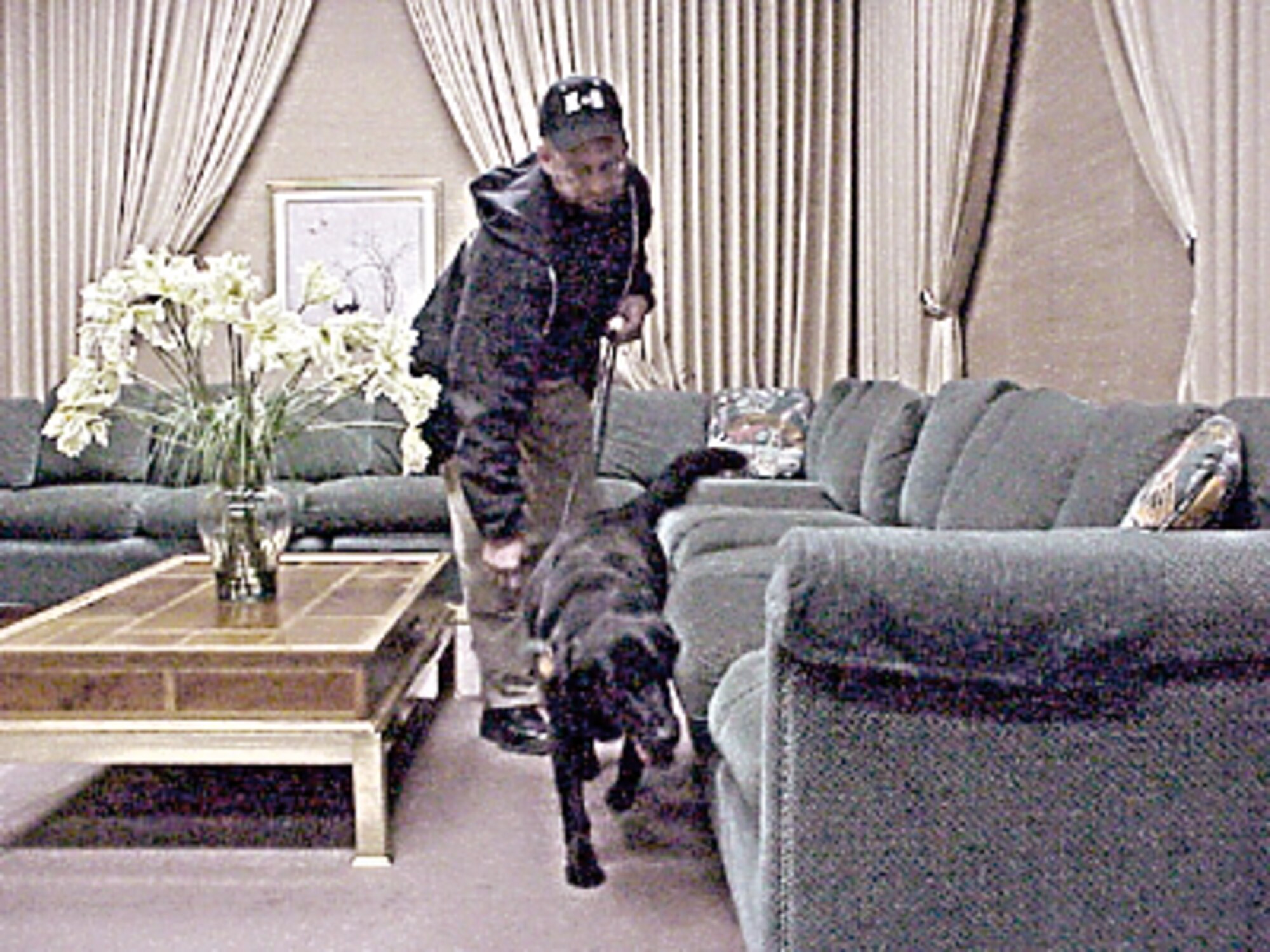 Roger Miller, a certified explosives and narcotics detection dog trainer, and his dog, Abbey, perform the initial security sweep for Utah Gov. Jon Huntsman's inauguration in January 2006.

