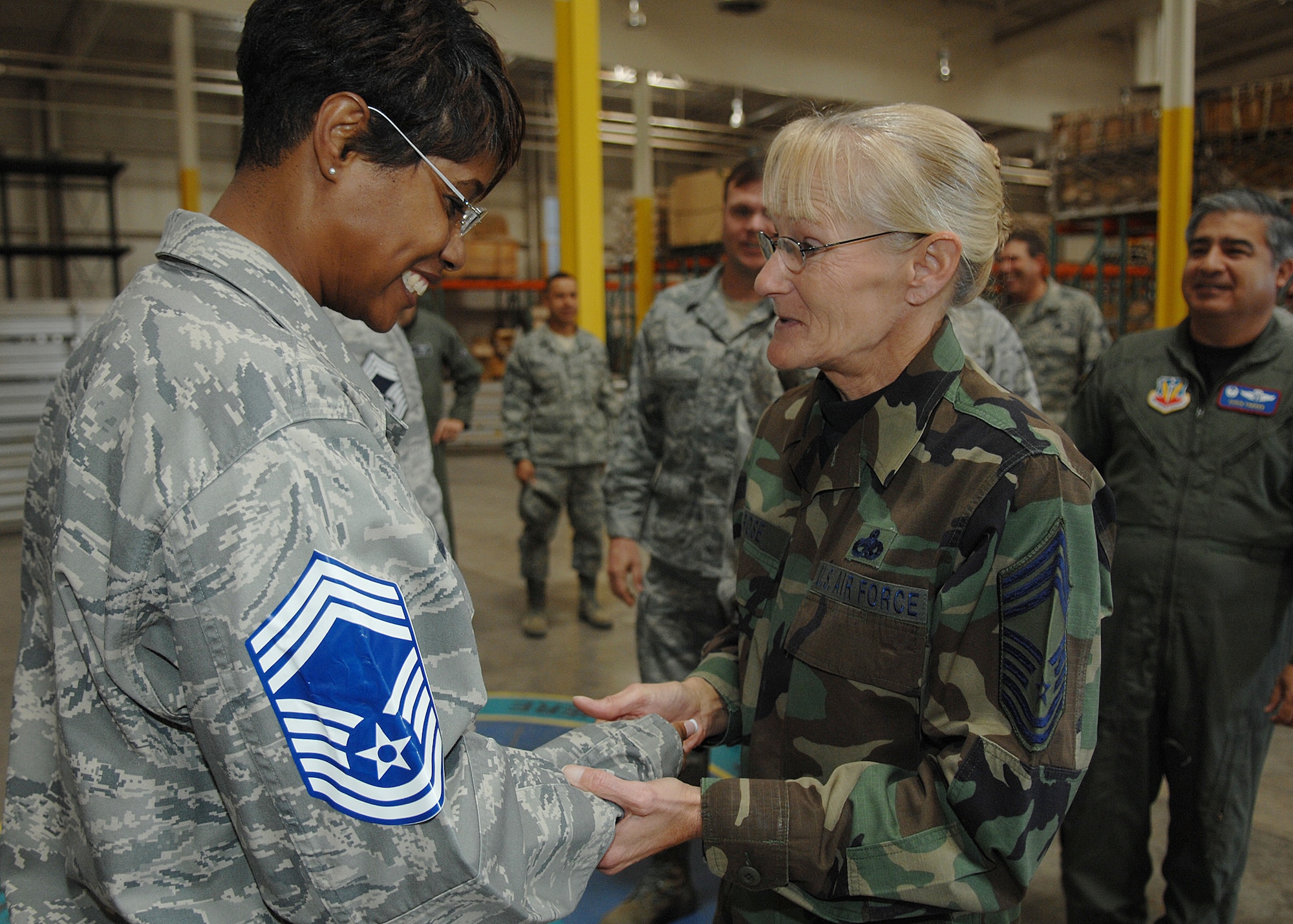 Chief Master Sgt. Kathleen Rose, 49th Materiel Maintenance Group, congratulates Senior Master Sgt. Kim Baker, 49th Materiel Maintenance Squadron, for her promotion to Chief Master Sergeant, Nov. 11, at Holloman Air Force Base, N.M. The Air Force recently announced the names of 520 Senior Master Sergeants who were selected for promotion to Chief Master Sergeant. (U.S. Air Force photo/ Senior Airman Anthony Nelson)

