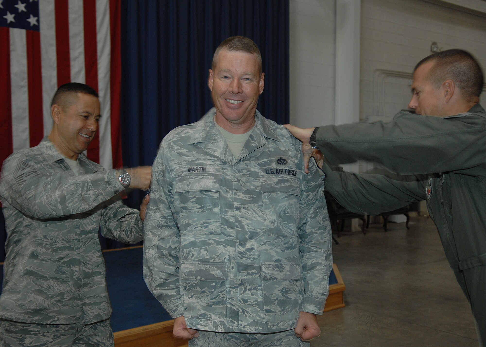 Senior Master Sgt. David Martin, 49th Material Maintenance Group, recieves notification of his promotion to Chief Master Sergeant by Col. Michael McGee, 49th Fighter Wing vice commander and the 49 FW Command Chief, Chief Master Sgt. Jeffery Cui, Nov. 11, at Holloman Air Force Base, N.M. The Air Force recently announced the names of 520 Senior Master Sergeants who were selected for promotion to Chief Master Sergeant. (U.S. Air Force photo/ Senior Airman Anthony Nelson)
