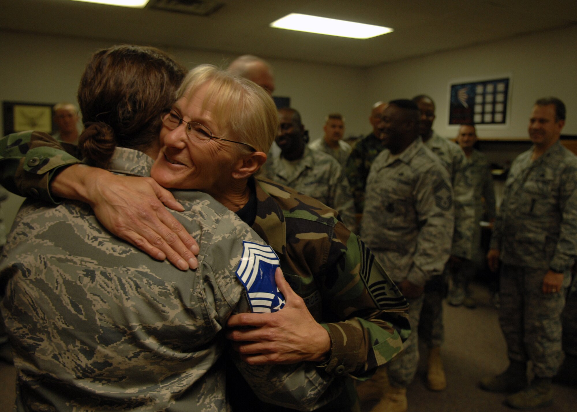 Chief Master Sgt. Kathleen Rose, 49th Material Maintenance Group, congratulates Senior Master Sgt. Kathleen Harmon, 49th Aircraft Maintenance Squadron, for her promotion to Chief Master Sergeant, Nov. 11 at Holloman Air Force Base, N.M. The Air Force recently announced the names of 520 Senior Master Sergeants who were selected for promotion to Chief Master Sergeant. (U.S. Air Force photo/ Senior Airman Anthony Nelson)
