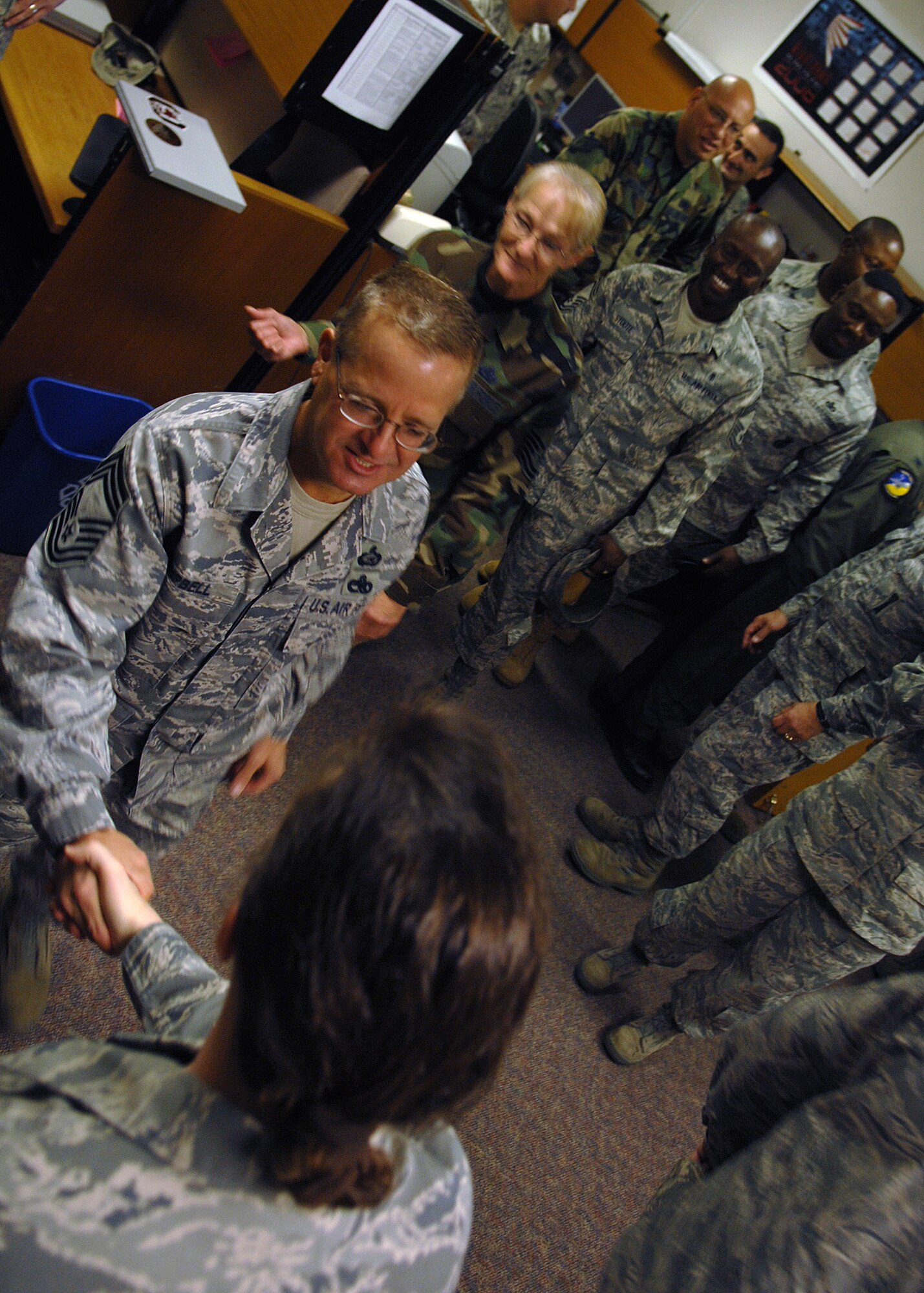 Several Chief Master Sergeants and squadron commanders from around the wing came to show their support for Senior Master Sgt. Kathleen Harmon, 49th Aircraft Maintenance Squadron, for hier promotion to Chief Master Sergeant, Nov. 11, at Holloman Air Force Base, N.M. The Air Force recently announced the names of 520 Senior Master Sergeants who were selected for promotion to Chief Master Sergeant. (U.S. Air Force photo/Senior Airman Anthony Nelson)
