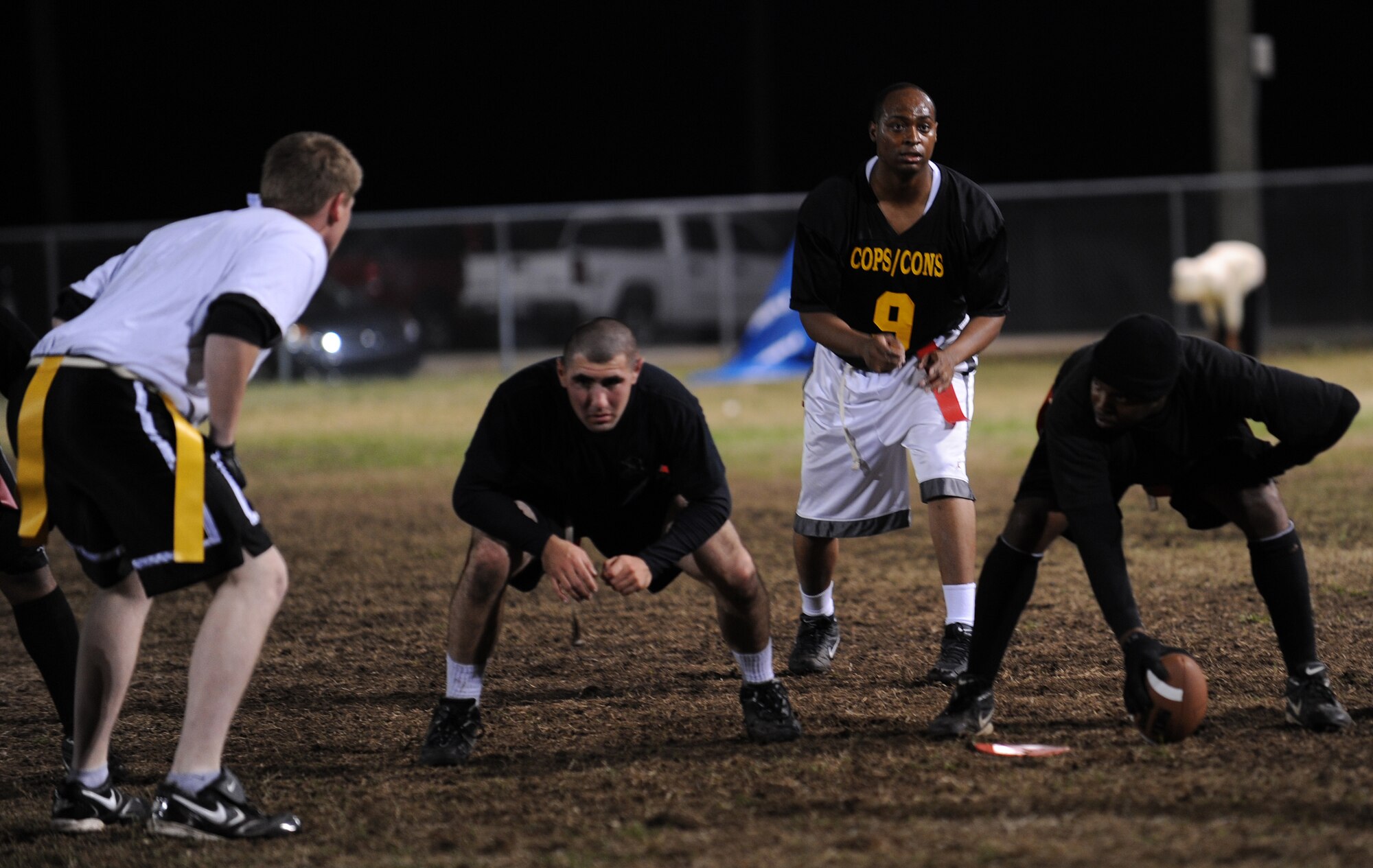 LANGLEY AIR FORCE BASE, Va. – The 1st Security Forces Squadron Defenders prepare to hike the ball against the 1st Equipment Maintenance Squadron Bulldog’s defense during the 2008 Intramural Flag Football Championship Nov. 10.  The Defenders beat the Bulldogs 14 to 6.  (U.S. Air Force photo/Airman 1st Class Zachary Wolf)