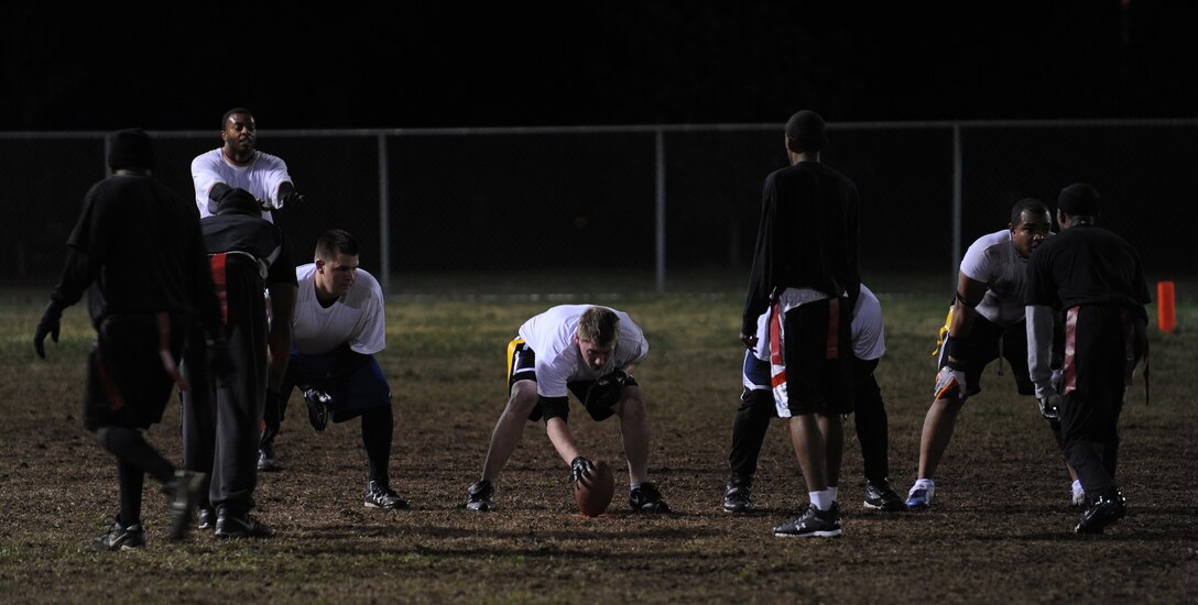 LANGLEY AIR FORCE BASE, Va. -- The 1st Equipment Maintenance Squadron Bulldogs prepare to hike the ball against the 1st Security Forces Squadron Defenders during the 2008 Intramural Flag Football Championship Nov. 10.  The Defenders beat the Bulldogs 14 to 6.  (U.S. Air Force photo/Airman 1st Class Zachary Wolf)