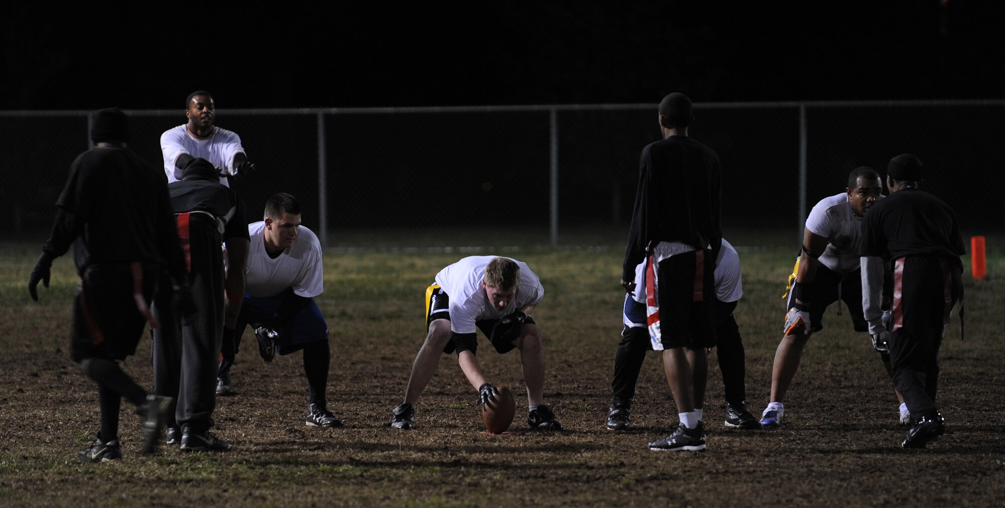 LANGLEY AIR FORCE BASE, Va. -- The 1st Equipment Maintenance Squadron Bulldogs prepare to hike the ball against the 1st Security Forces Squadron Defenders during the 2008 Intramural Flag Football Championship Nov. 10.  The Defenders beat the Bulldogs 14 to 6.  (U.S. Air Force photo/Airman 1st Class Zachary Wolf)