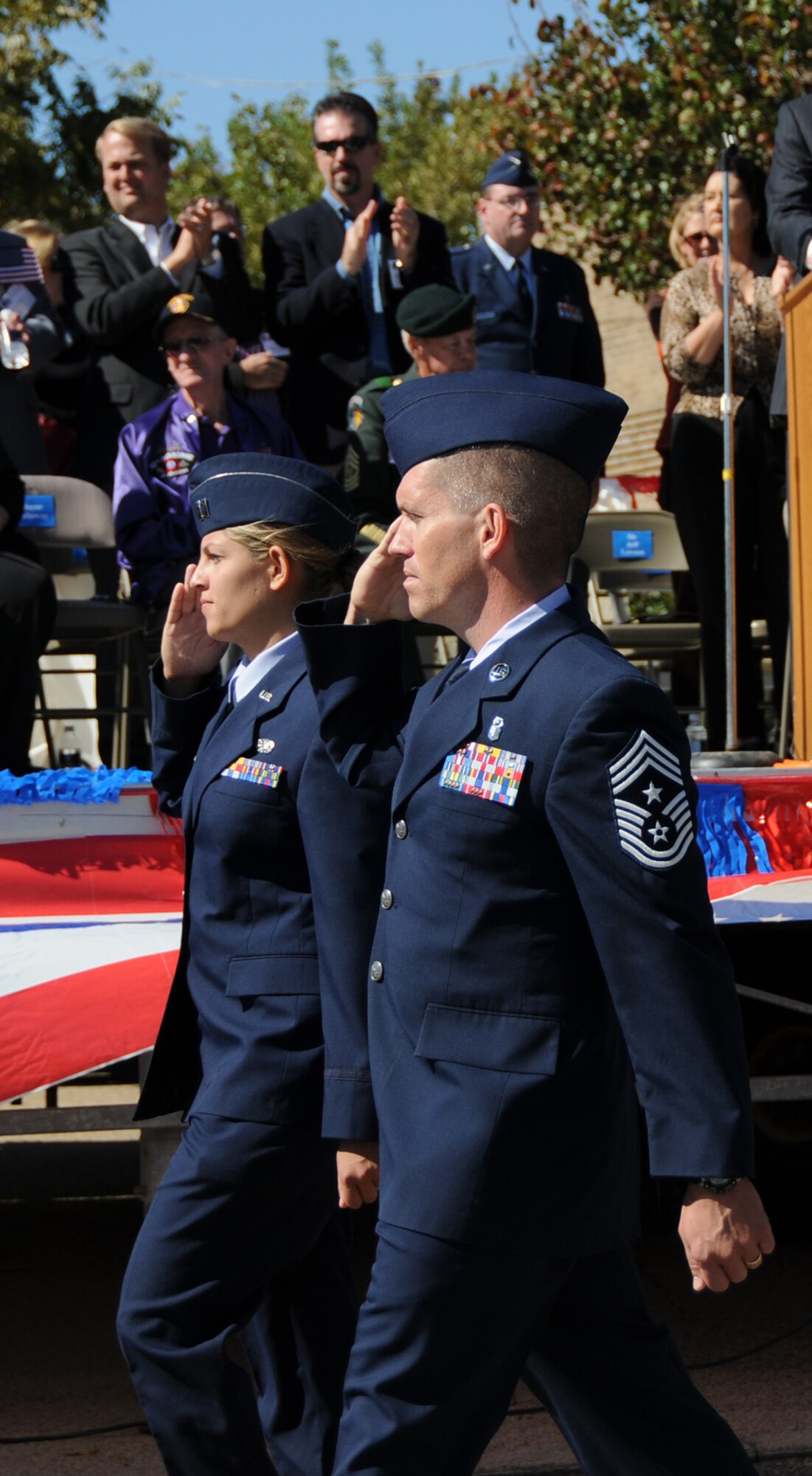 Capt. Cieara Carson, left, 81st Communications Squadron, and Chief Master Sgt. Alex Perry, 81st Training Wing command chief, pass the reviewing stand at the Gulf Coast Veterans Day Parade, Nov. 8 in Biloxi.  (U.S. Air Force photo by Kemberly Groue)