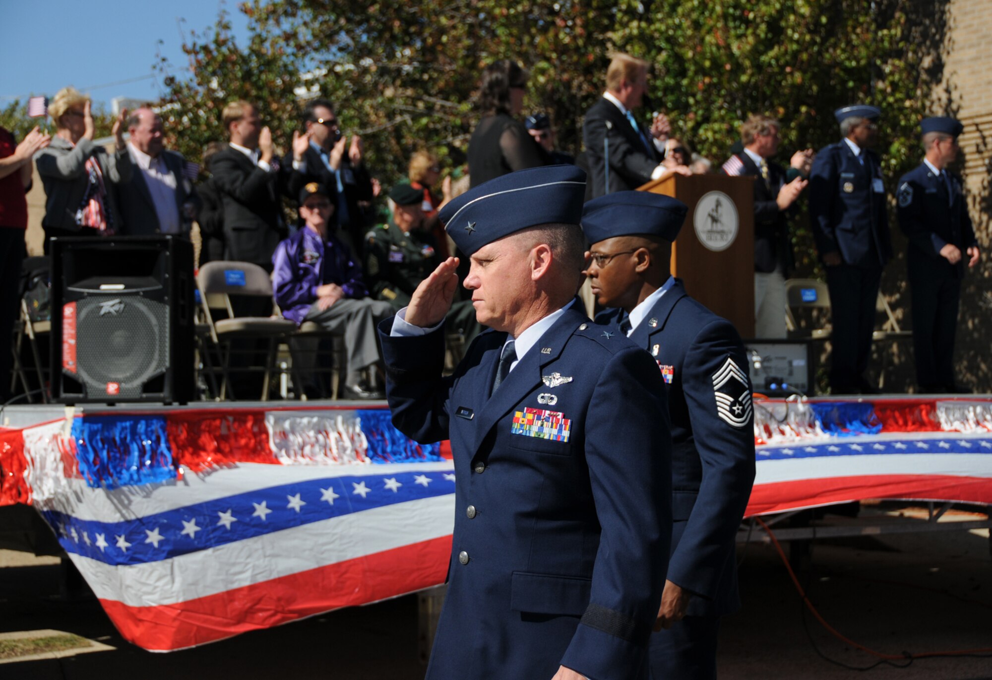 Brig. Gen. Dan Wyman, left,  81st Medical Group commander, and Chief Master Sgt. Ronald Ward, 81st Diagnostics and Therapeutics Squadron superintendent, pass the reviewing stand at the Gulf Coast Veterans Day Parade, Nov. 8 in Biloxi.  (U.S. Air Force photo by Kemberly Groue)