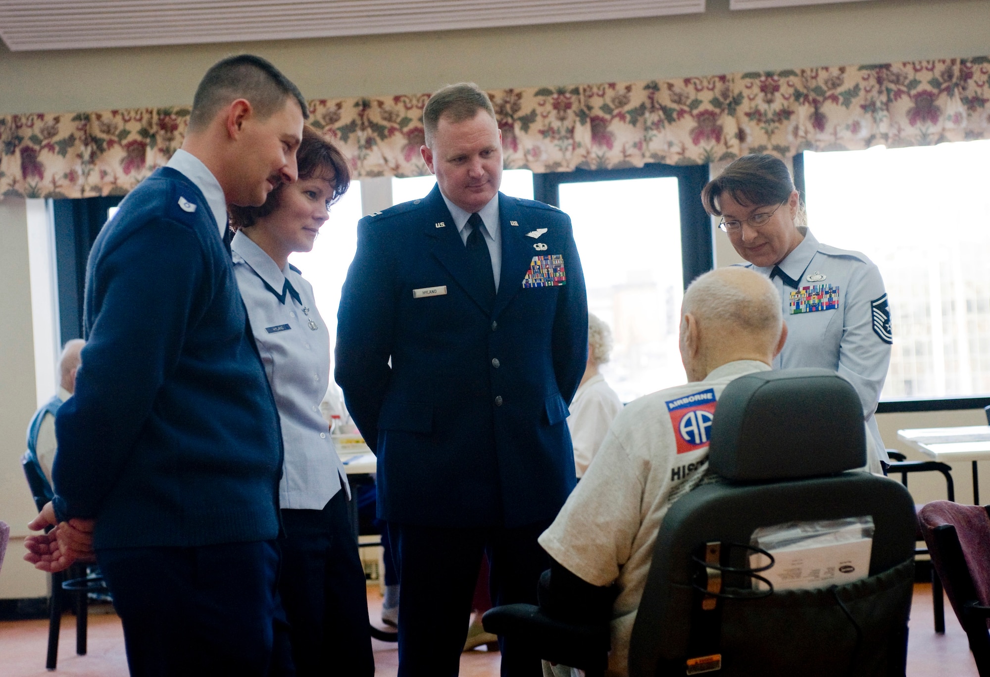 ANCHORAGE, Alaska -- Airmen from Elmendorf Air Force Base listens to a veteran at Anchorage Pioneer Home Nov. 7. Arctic Warriors spent some time with veterans to socialize and eat ice cream. (U.S. Air Force photo/Senior Airman Jonathan Steffen)
