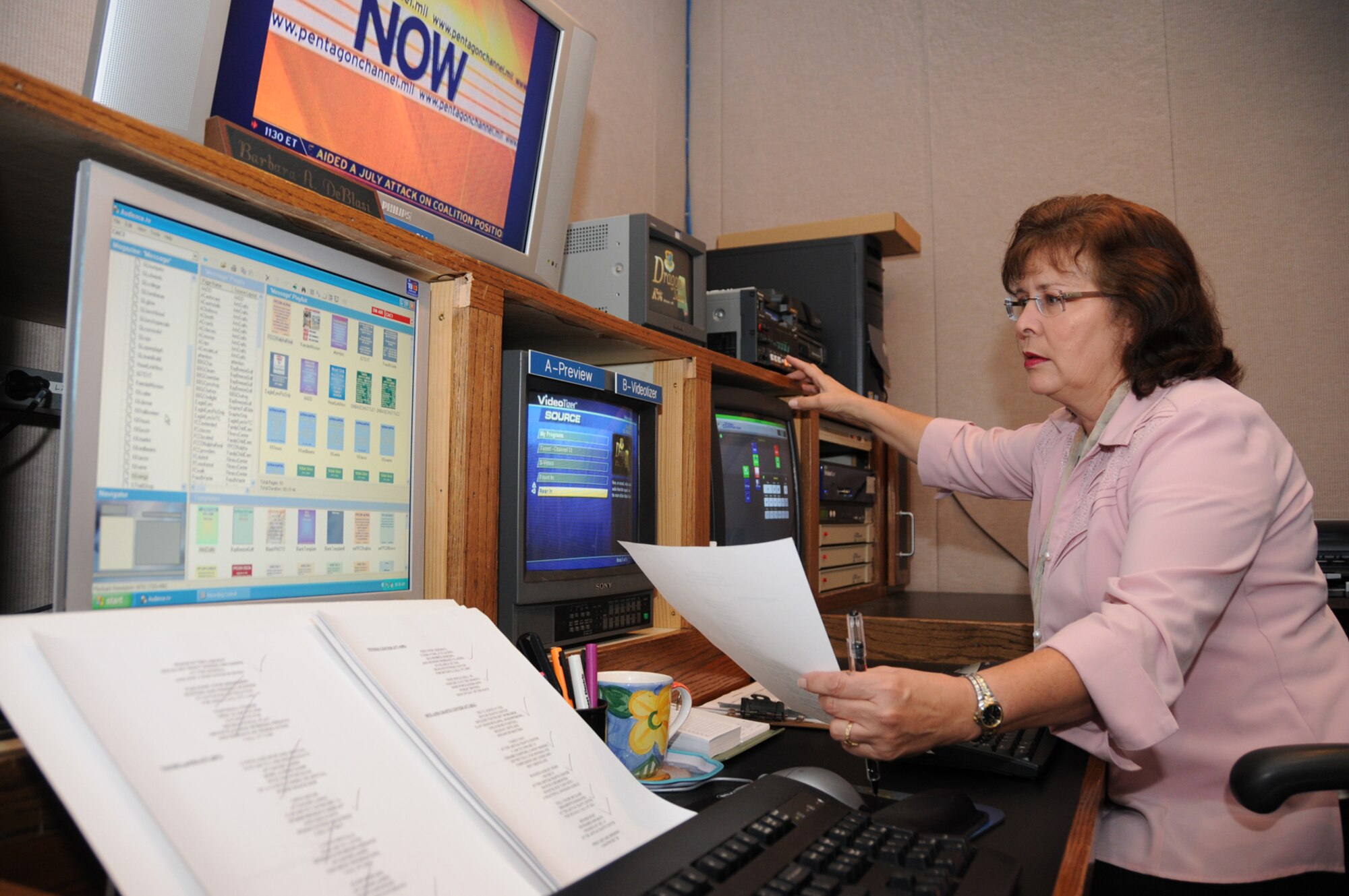 Digital media artist Barbara De Blasi updates information on the commander’s access channel.  (U.S. Air Force photo by Kemberly Groue)