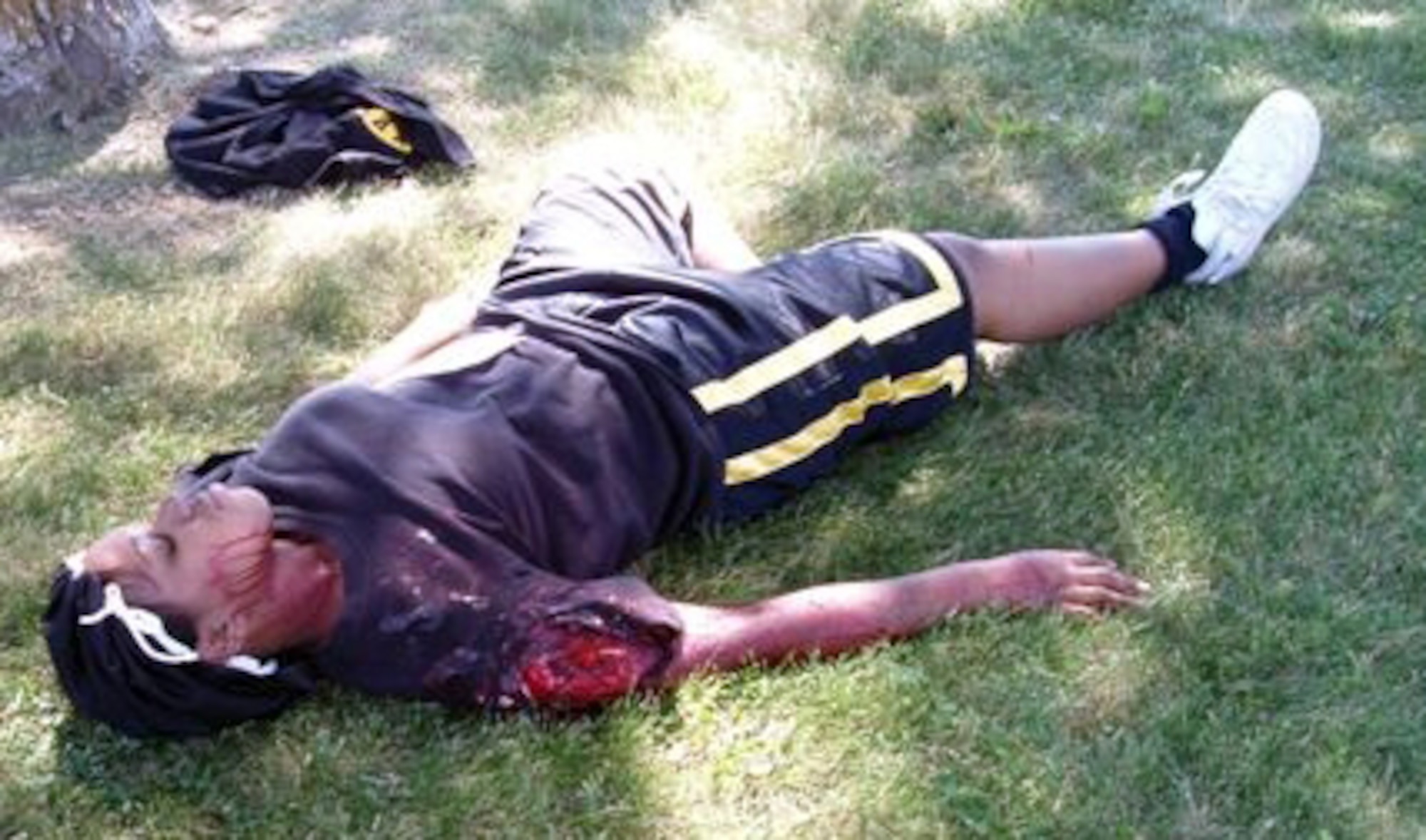 During an emergency response exercise, a "victim" lies in wait to be found and treated. The simulated wounds were created my members of the 28th Medical Group Moulage Team. The team uses many various materials to create the needed effects for injuries, including everything from waxes and glues to chicken bones. (Courtesy photo/28 MDG Moulage Team)