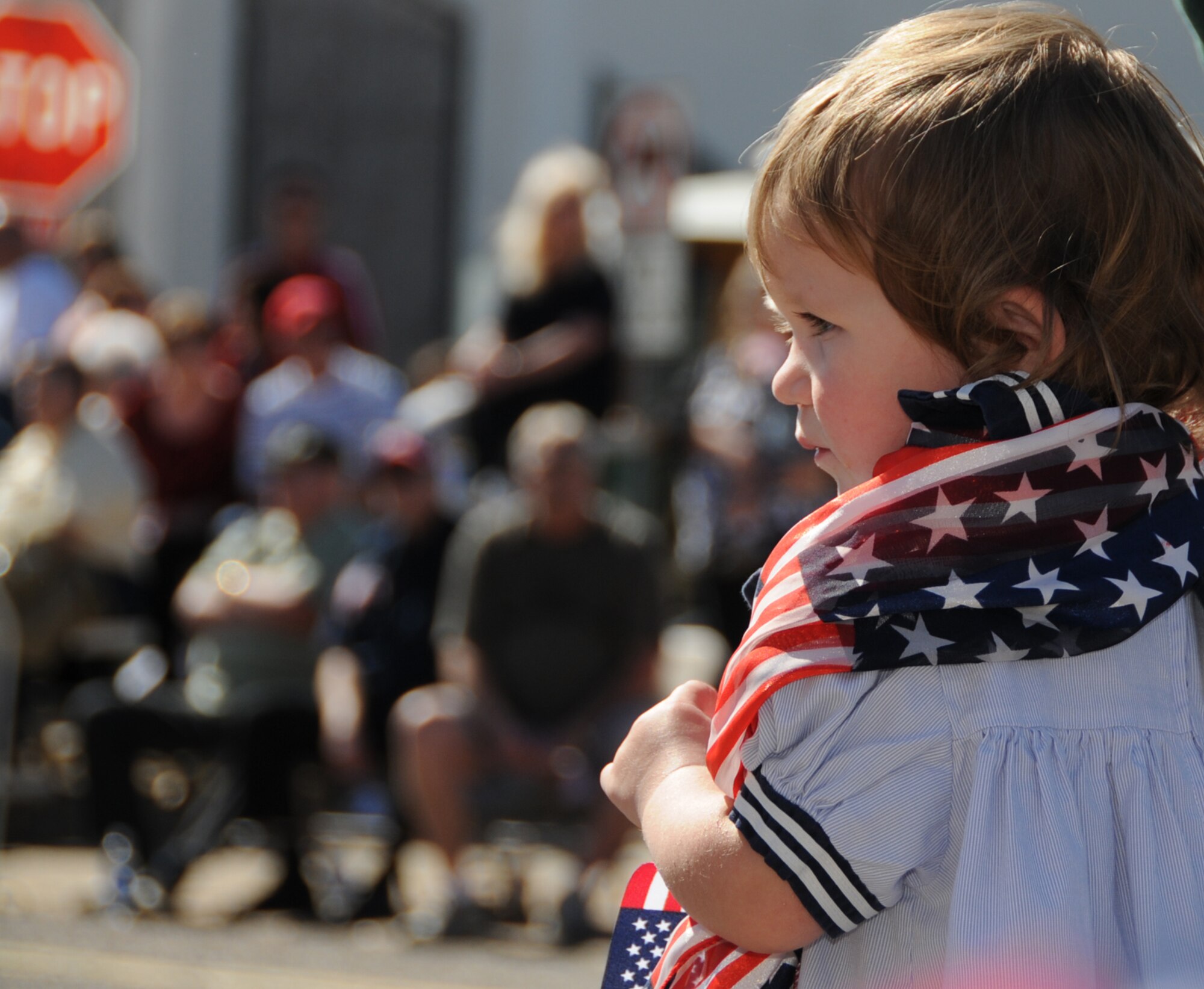 One-year-old Rebecca Cavin, daughter of Angela and Bob Cavin of Long Beach, watches the parade.  Her uncle, Chris, is stationed at the Naval Construction Battalion Center, Gulfport.  (U.S. Air Force photo by Kemberly Groue)