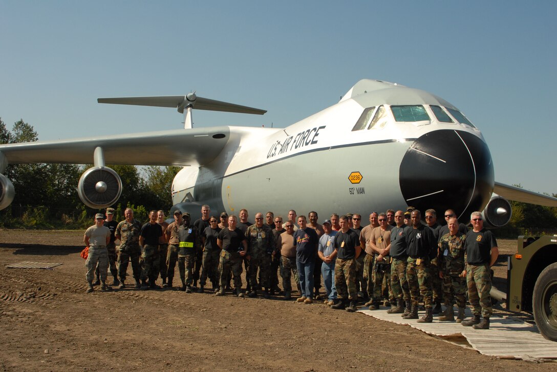 SCOTT AIR FORCE BASE, Ill. - It took a massive group consisting of members of the 126th Air Refueling Wing, the 375th Airlift Wing, and the 932nd Airlift Wing nearly two days to move  a C-141 Starlifter into its final place of honor in the newly developed Scott Field Heritage Airpark.  The aircraft, tail number 50-236, was a "Freedom Bird" aircraft used to transport repatriated POWs and troops back to the U.S. at the end of their tours in Vietnam.  The aircraft initially spent time in the 126 ARW maintenance hangar where it was prepared for permanent static display and then restored to its original colors and paint scheme before being transported on Sept. 9 and 10 to the airpark. (Photographer unknown)