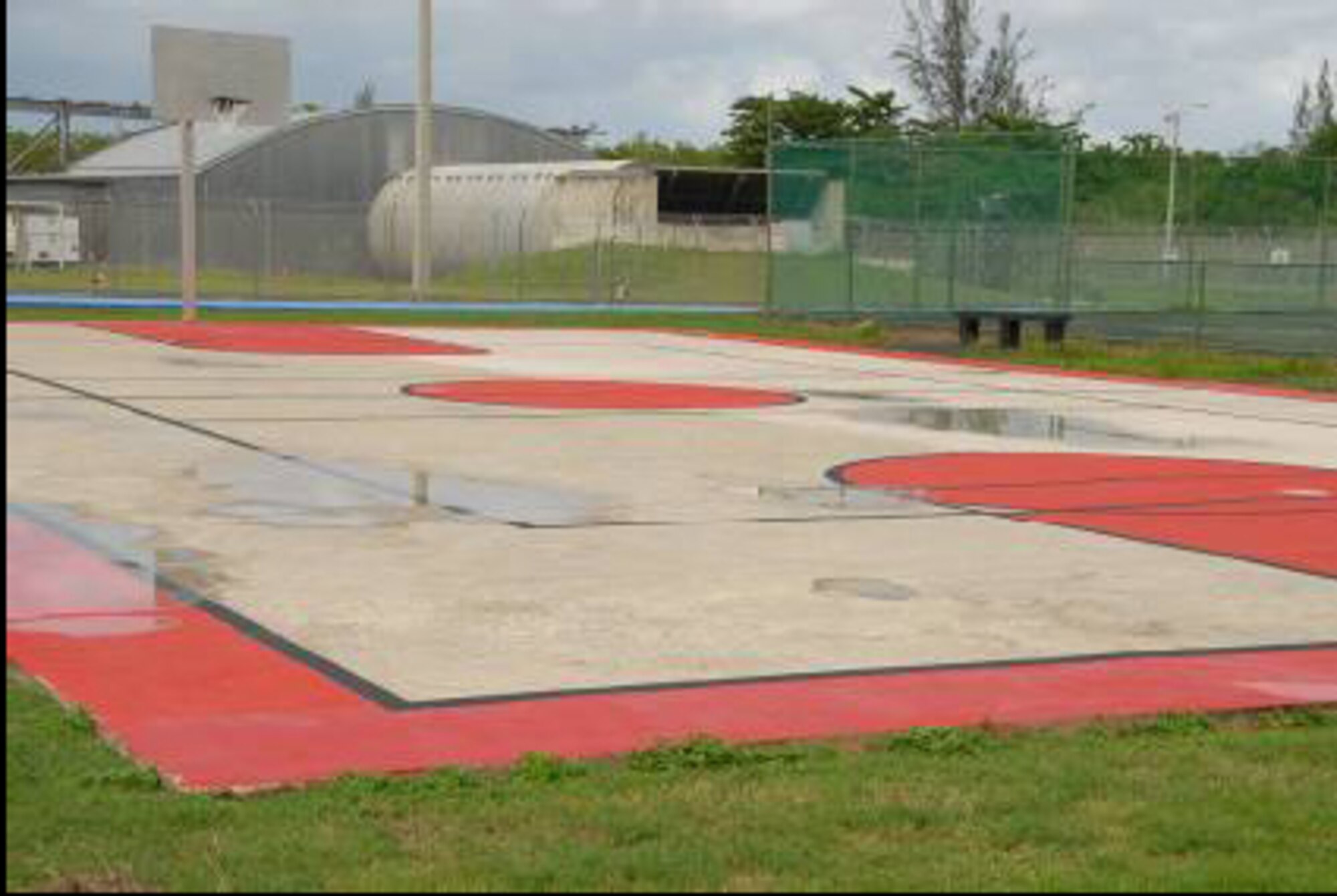 Volunteers repainted the Muniz basketball court. The backboard and basketball rim were given corrosion control treatment and repainted as well. 