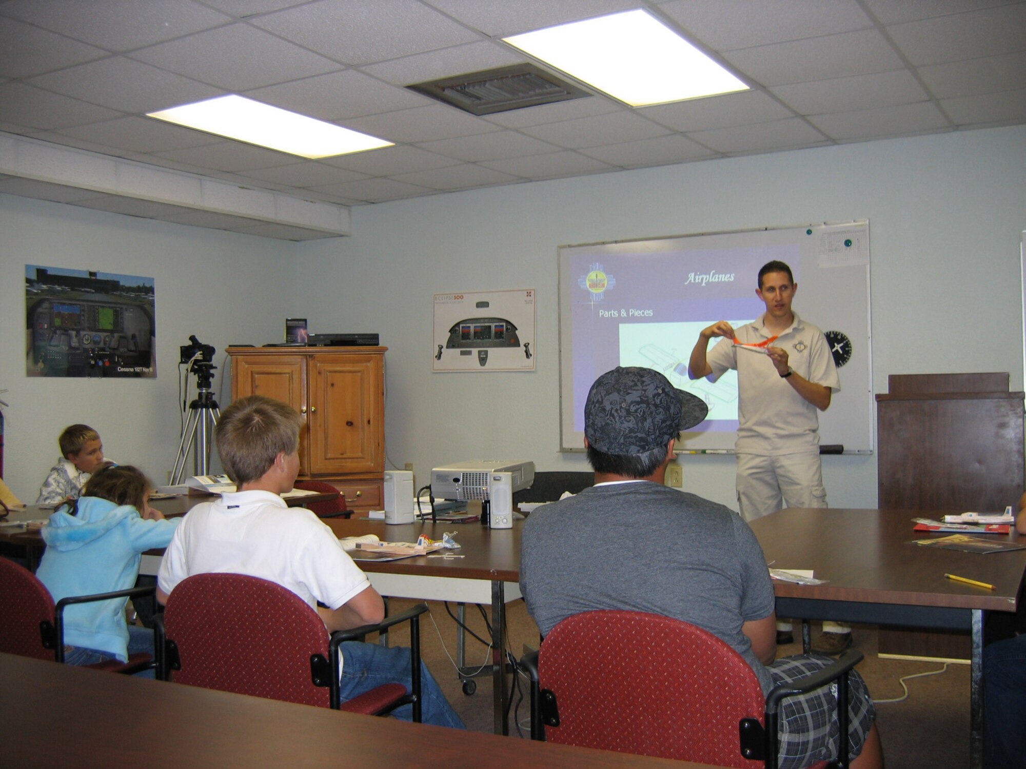 Staff Sgt. Adam Ray, 49th Aircraft Maintenance Squadron, encourages participation from the class while teaching students about aircraft characteristics at the Aero Club at Holloman Air Force Base, N.M., Oct. 22. (Photo provided)