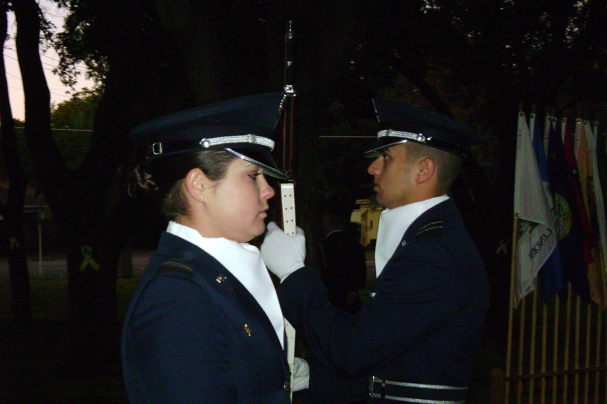 Air Force Reserve Officer Training Corps Cadets 3rd Class Christine Boswell and Edward Pena exchange responsibility for the vigil during the Air Force ROTC Det. 847 / Arnold Air Society Veterans Day Vigil Nov. 7. at Angelo State University. The annual ceremony is a combined effort of ASU Arnold Air Society, Silver Wings and volunteers from Det 847, conducted in honor and remembrance to those ASU students who made the ultimate sacrifice. (U.S. Air Force photo)