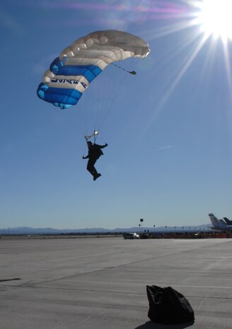 A member of Wings of Blue, assigned to the 98th Flying Training Squadron U.S. Air Force Academy, Co., sails from the sky during an aerial performance during an air show at Nellis Air Force Base, Nev., Nov. 8, 2008. The Nellis AFB air show showcased the 21st-century Air Force’s capabilities in air, space and cyberspace. The show, held Nov. 8-9. is the largest aviation event in Las Vegas and the largest free public event in Nevada. (U.S. Air Force Photo/Senior Airman Larry E. Reid Jr.)