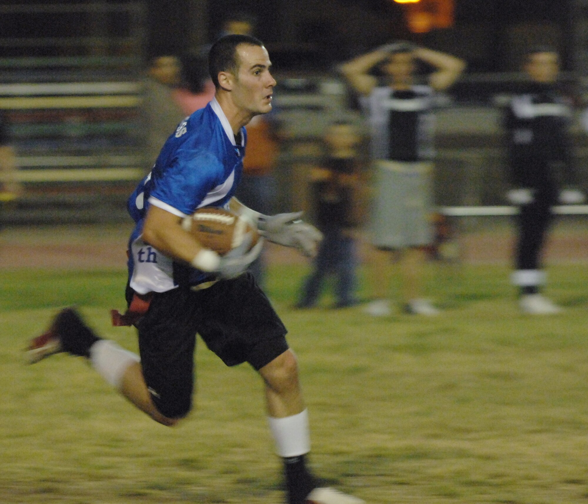 Nicholas Cross, 728th Air Mobility Squadron, sprints downfield after a short pass reception. The 728 AMS flag football team placed second in Incirlik’s intramural tournament. (U.S. Air Force photo by Senior Airman Benjamin Wilson)