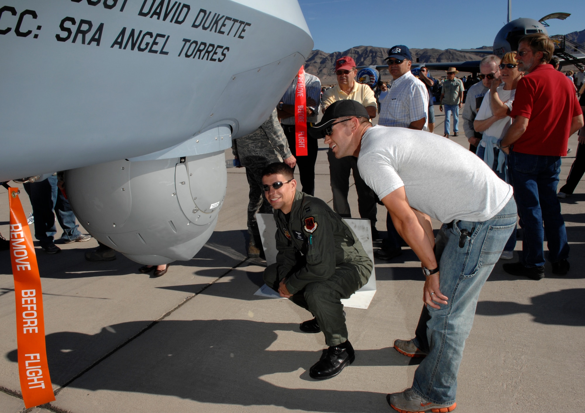 Air show spectators explore an MQ-9 Reaper static display during an air show at Nellis Air Force Base, Nev., Nov. 8, 2008. The Nellis AFB air show showcased the 21st-century Air Force’s capabilities in air, space and cyberspace. The show, held Nov. 8-9. is the largest aviation event in Las Vegas and the largest free public event in Nevada.
(U.S. Air Force Photo/Senior Airman Larry E. Reid Jr.)