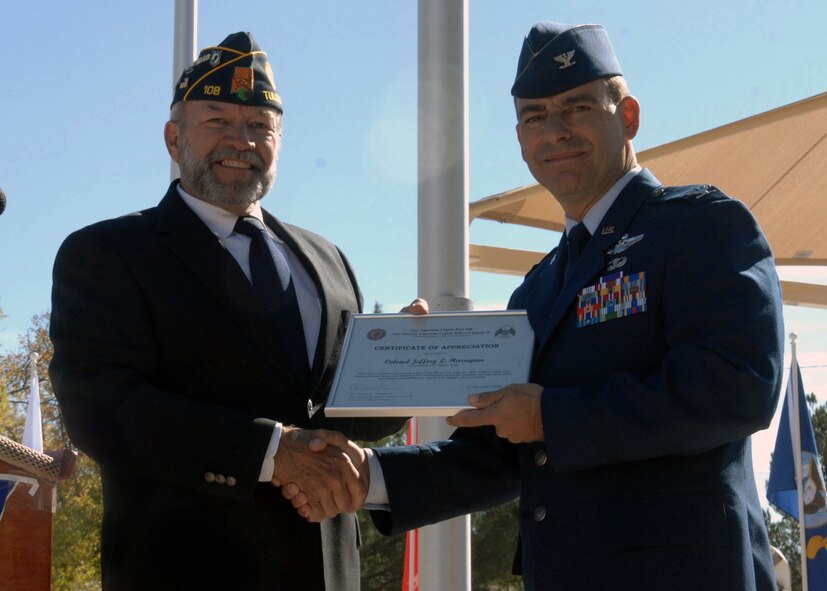 Ed Summerall, American Legion Post 108 commander, presents Col. Jeff Harrigian, 49th Fighter Wing commander at Holloman Air Force Base, N.M., with a certificate of appreciation during the Veterans Day Observance ceremony, Nov. 11. As a guest speaker, Colonel Harrigian showed his appreciation with a speech for all veterans that gathered together at the Tularosa Veterans Memorial Park, N.M.. (U.S. Air Force photo/Airman 1st Class Veronica Salgado)