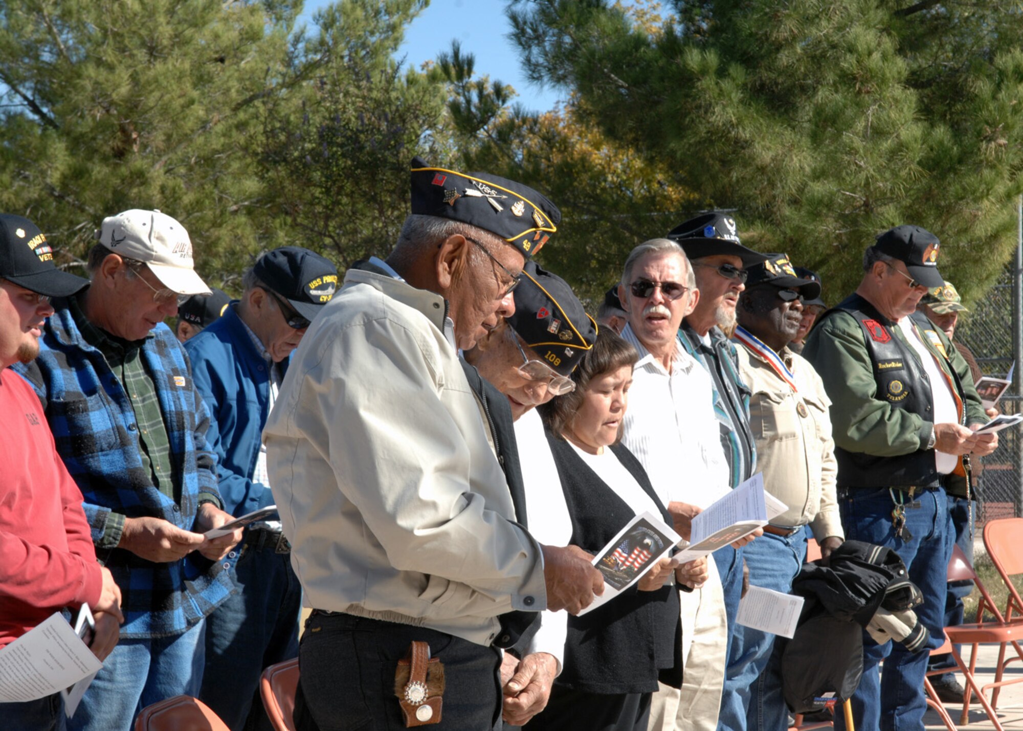 Veterans sing God Bless America at the Tularosa Veterans Memorial Park, Nov. 11.  Members of all branches came out to Tularosa, N.M., for the ceremonial appreciation. (U.S. Air Force photo/Airman 1st Class Veronica Salgado) 