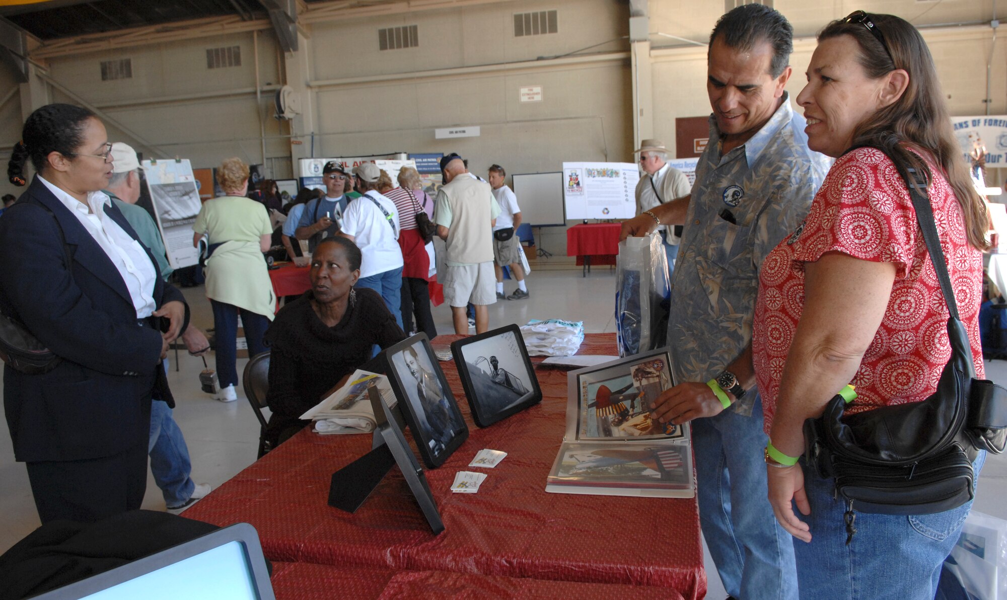 Air show guests explore historical exhibits at the aviation history and exhibits hangar during an air show at Nellis Air Force Base, Nev., Nov. 8, 2008. The Nellis AFB air show showcased the 21st-century Air Force’s capabilities in air, space and cyberspace. The show, held Nov. 8-9. is the largest aviation event in Las Vegas and the largest free public event in Nevada.
(U.S. Air Force Photo/Senior Airman Larry E. Reid Jr.)