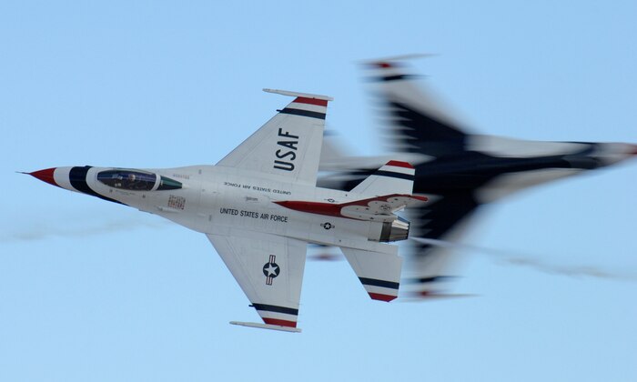 F-15 Fighting Falcons assigned to the U.S. Air Force Air Demonstration Squadron, The Thunderbirds, conduct the opposing pass maneuver during the air show at Nellis Air Force Base, Nev., Nov. 8, 2008. The Nellis AFB air show showcased the 21st-century Air Force’s capabilities in air, space and cyberspace. The show, held Nov. 8-9. is the largest aviation event in Las Vegas and the largest free public event in Nevada.(U.S. Air Force Photo/Senior Airman Larry E. Reid Jr.)
