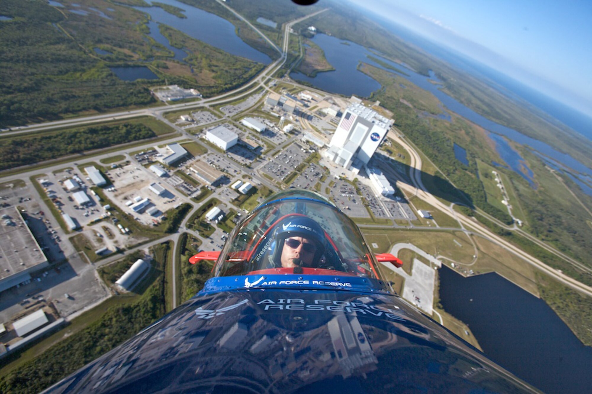 Lt. Col. Ed Hamill, 301st Fighter Squadron instructor pilot, flies the Air Force Reserve biplane over the Kennedy Space Center. Colonel Hamill, who is a reservist with the 944th Fighter Wing, was able to fly over the Space Shuttle Endeavor on launch pad A, which is scheduled to lift off Nov 14, 2008. (Courtesy photo) 
