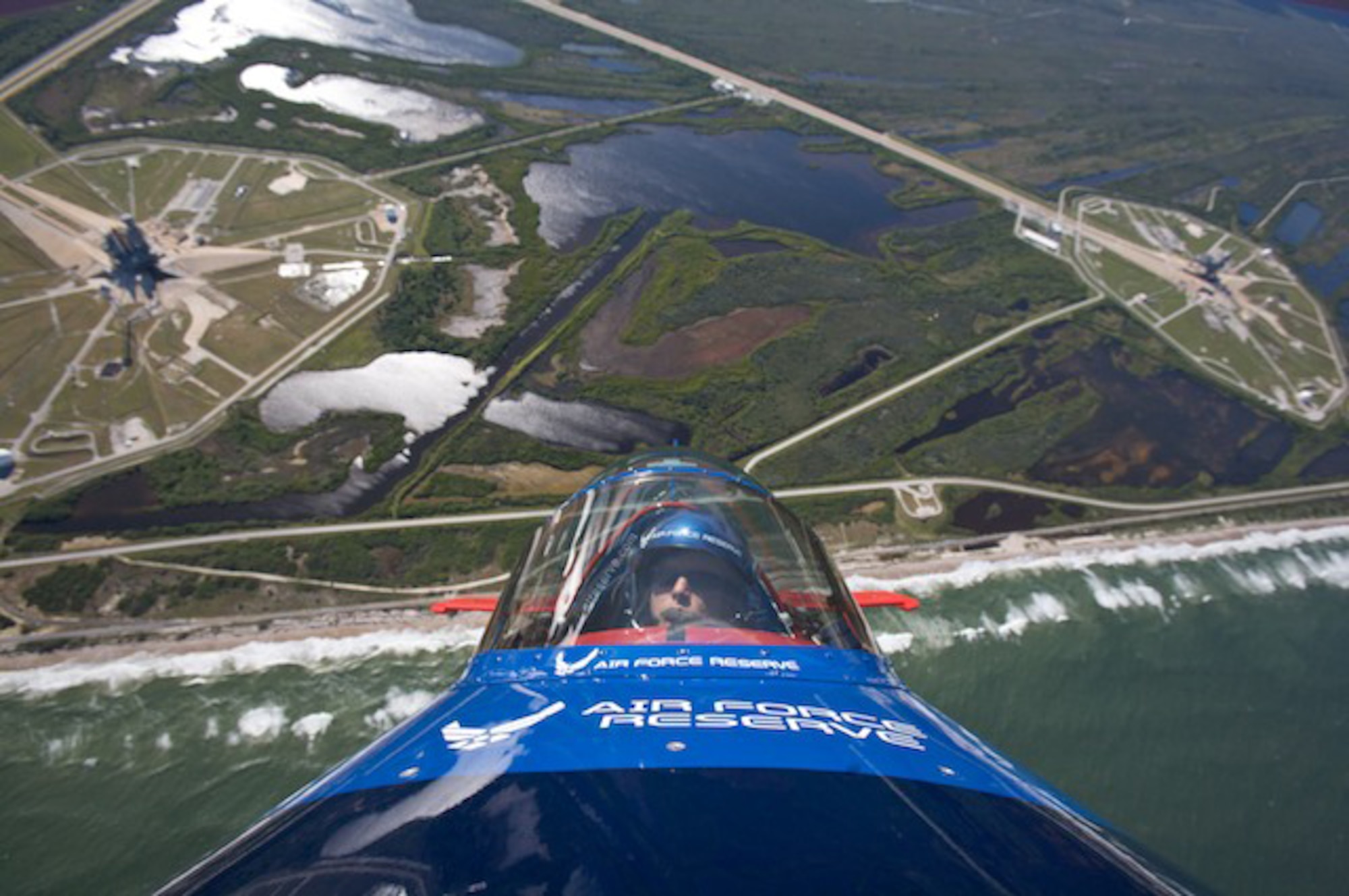 Lt. Col. Ed Hamill, 301st Fighter Squadron instructor pilot, flies the Air Force Reserve biplane over the Kennedy Space Center. Colonel Hamill, who is a reservist with the 944th Fighter Wing, was able to fly over the Space Shuttle Endeavor on launch pad A, which is scheduled to lift off Nov 14, 2008. (Courtesy photo) 