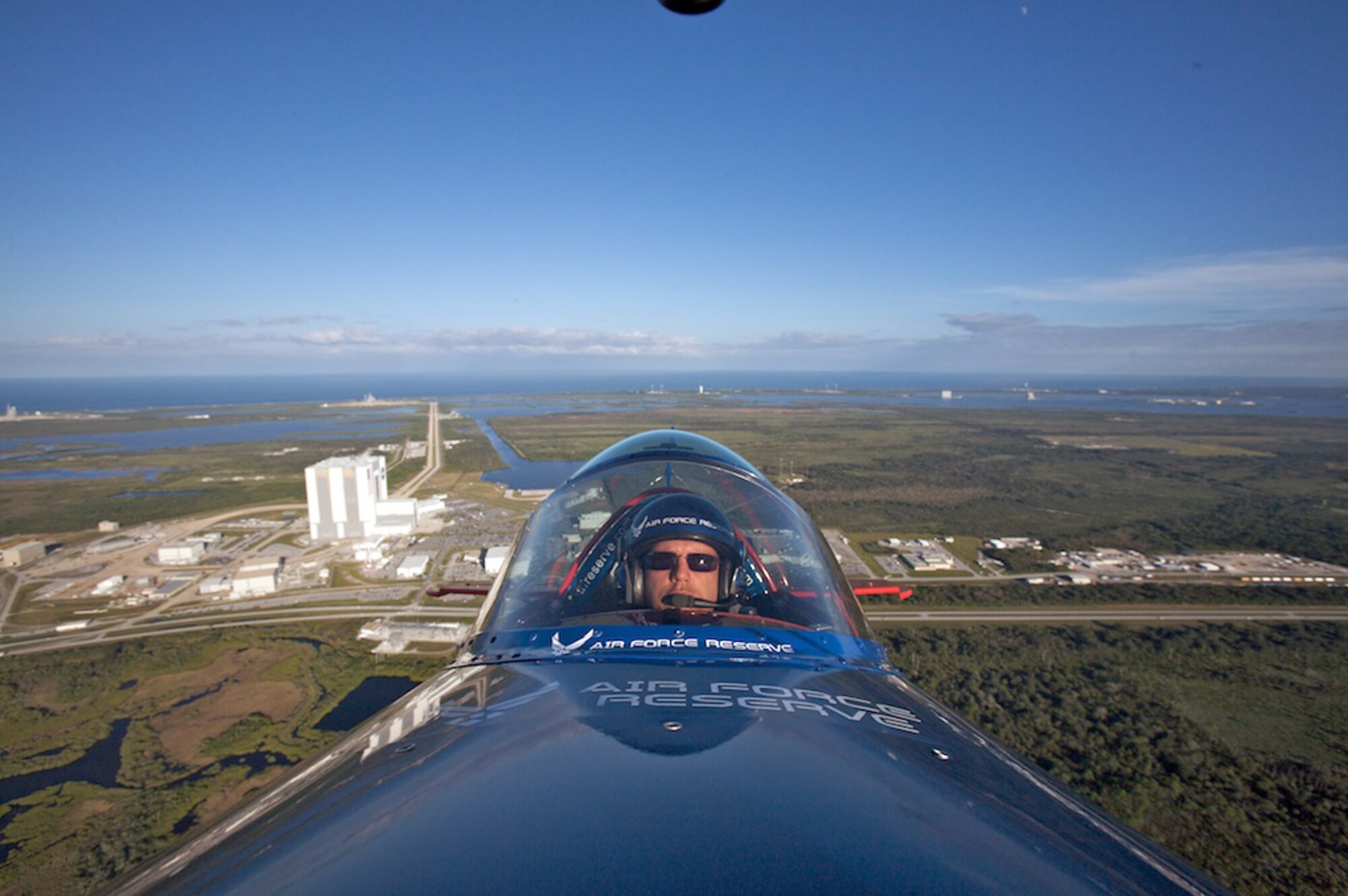 Lt. Col. Ed Hamill, 301st Fighter Squadron instructor pilot, flies the Air Force Reserve biplane over the Kennedy Space Center. Colonel Hamill, who is a reservist with the 944th Fighter Wing, was able to fly over the Space Shuttle Endeavor on launch pad A, which is scheduled to lift off Nov 14, 2008. (Courtesy photo) 
