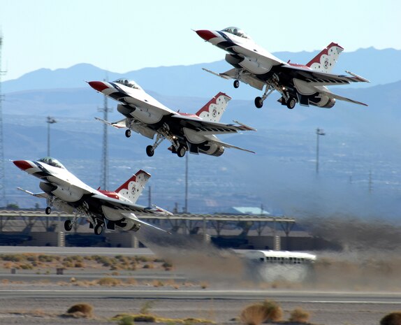 F-16 Fighting Falcons assigned to the U.S. Air Force Air Demonstration Squadron, The Thunderbirds, take off to perform during the air show at Nellis Air Force Base, Nev., Nov. 8, 2008. The Nellis AFB air show showcased the 21st-century Air Force’s capabilities in air, space and cyberspace. The show, held Nov. 8-9. is the largest aviation event in Las Vegas and the largest free public event in Nevada.(U.S. Air Force Photo/Senior Airman Larry E. Reid Jr.)