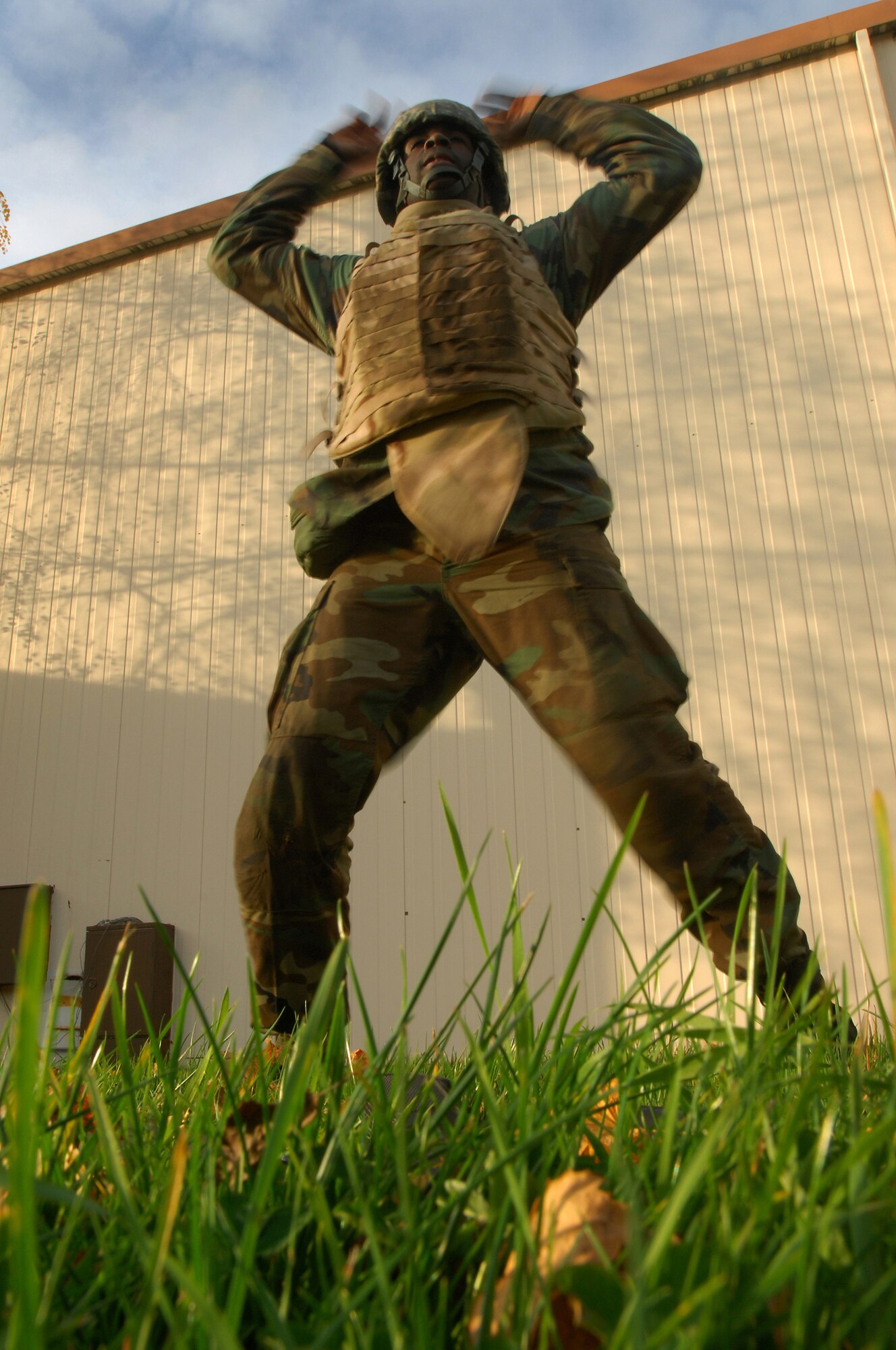 Airman 1st Class Roland Byrd 435th, Communications Squadron, performs calisthenics during Combat Skills Training Nov. 12, 2008, Einseidlerhof Air Station, Germany. Airmen participated in a two day Combat Skills Training course in preparation for deployment. (U.S. Air Force photo Airman 1st Class Kenny Holston)