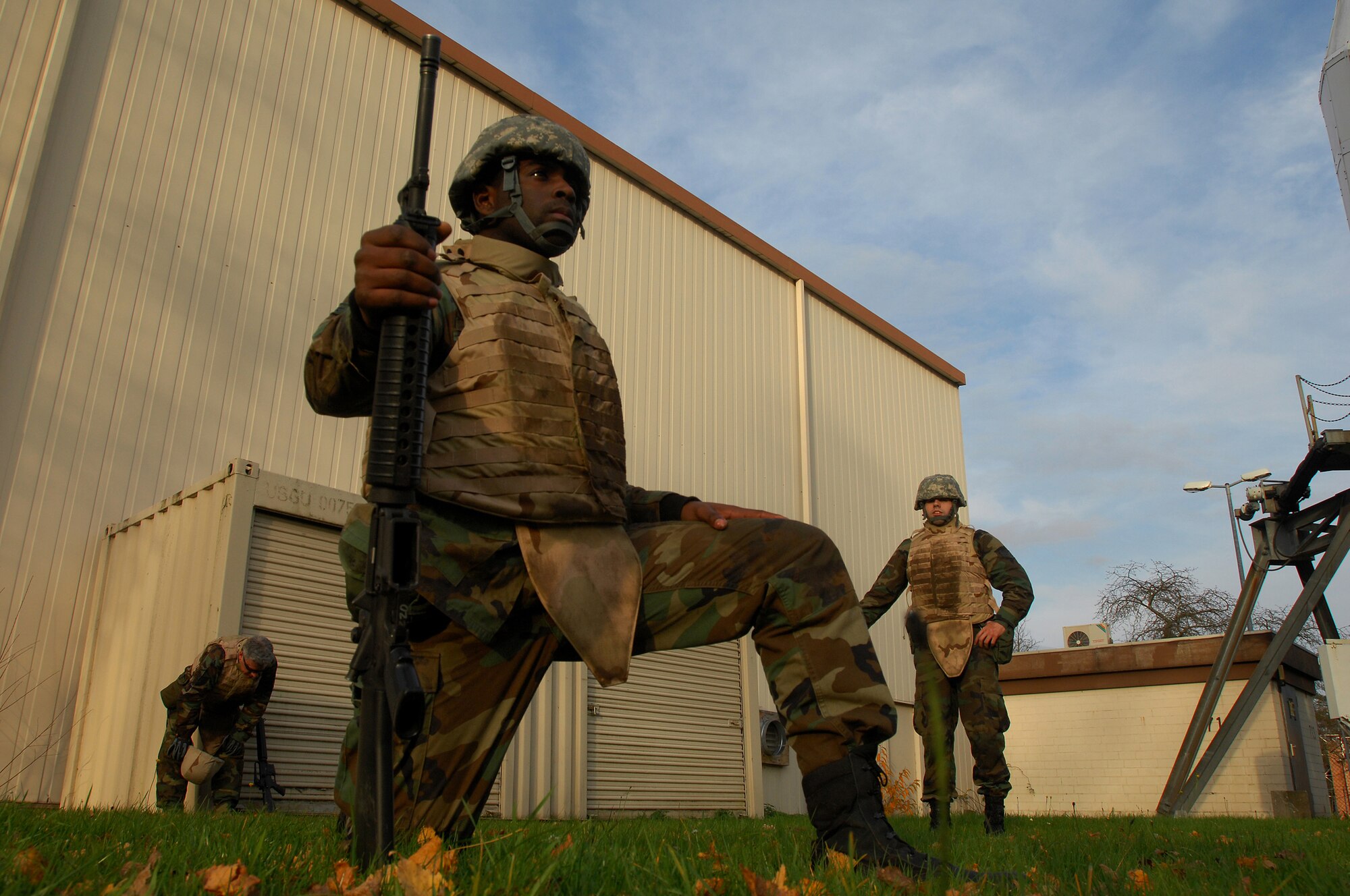 Airman 1st Class Roland Byrd 435th, Communications Squadron, takes a knee to wait for further instruction after an intense low crawl session Nov. 12, 2008, Einseidlerhof Air Station, Germany. Airmen participated in a two day Combat Skills Training course in preparation for deployment. (U.S. Air Force photo Airman 1st Class Kenny Holston)