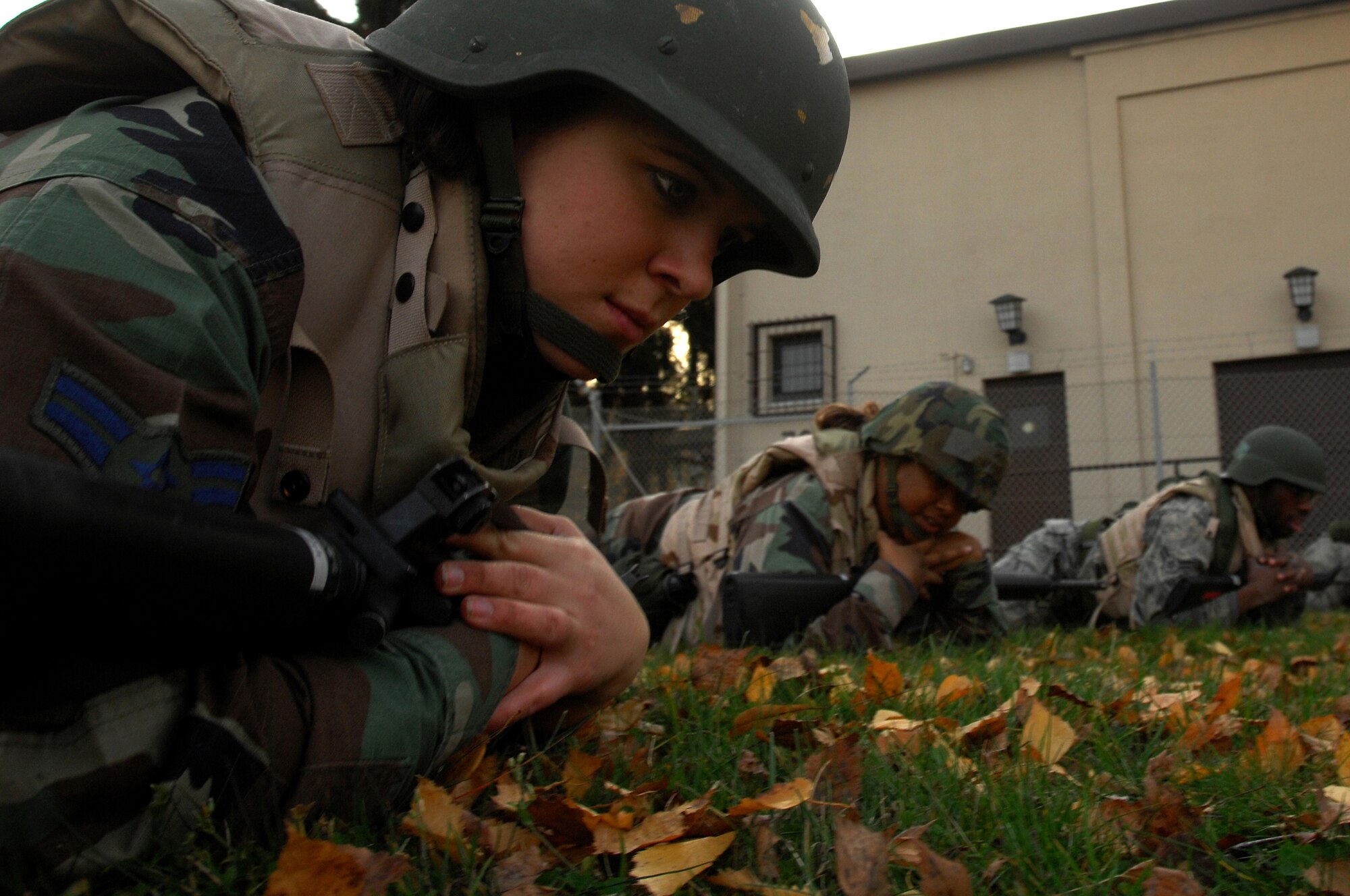 Airman 1st Class Beraiah Sprague, 435th Munitions Squadron, low crows while taking simulated fire during Combat Skills Training Nov. 12, 2008, Einseidlerhof, Germany. Airmen participated in a two day Combat Skills Training course in preparation for deployment. (U.S. Air Force photo Airman 1st Class Kenny Holston)