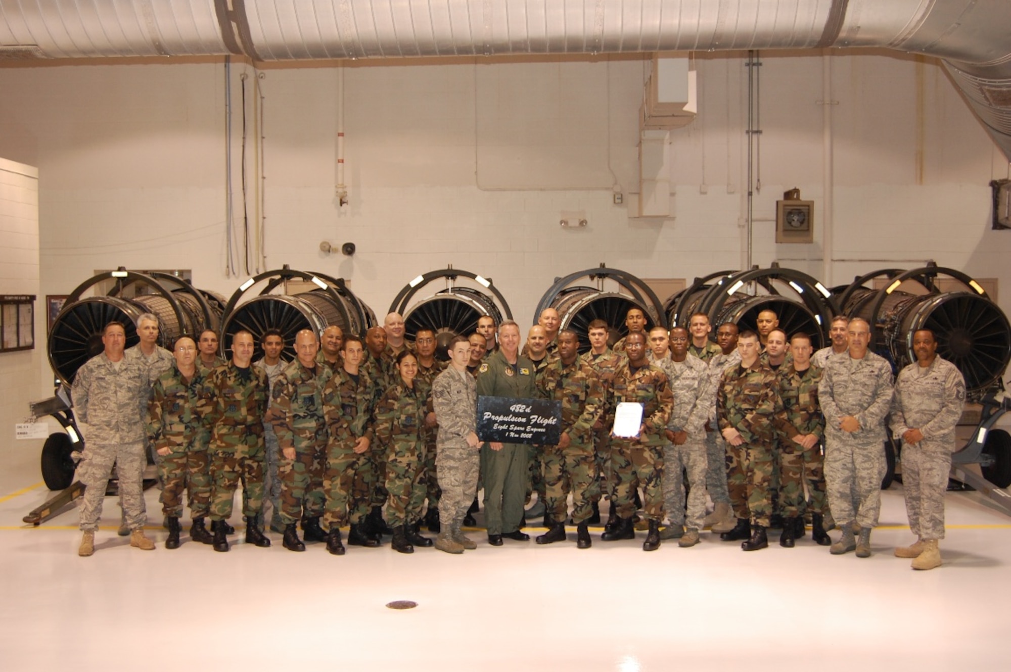 Members of the 482nd Maintenance Squadron Propulsion Flight pose with Col. William B. Binger, 482nd Fighter Wing commander after receiving an award for completing repairs on an eighth spare F-16 jet engine on Nov. 1. 

“It is an uncommon sight to have this many engines on the spare line. It takes dedicated and talented personnel working as a team to accomplish”, said Senior Master Sgt. Charles Kotsay Jr., propulsion flight chief.

“This outstanding achievement was the result of the tireless effort and consummate skill of the entire propulsion flight and engine management section personnel”, added Sergeant Kotsay. (U.S. Air Force photo/Master Sgt. Eugenio Flores)
