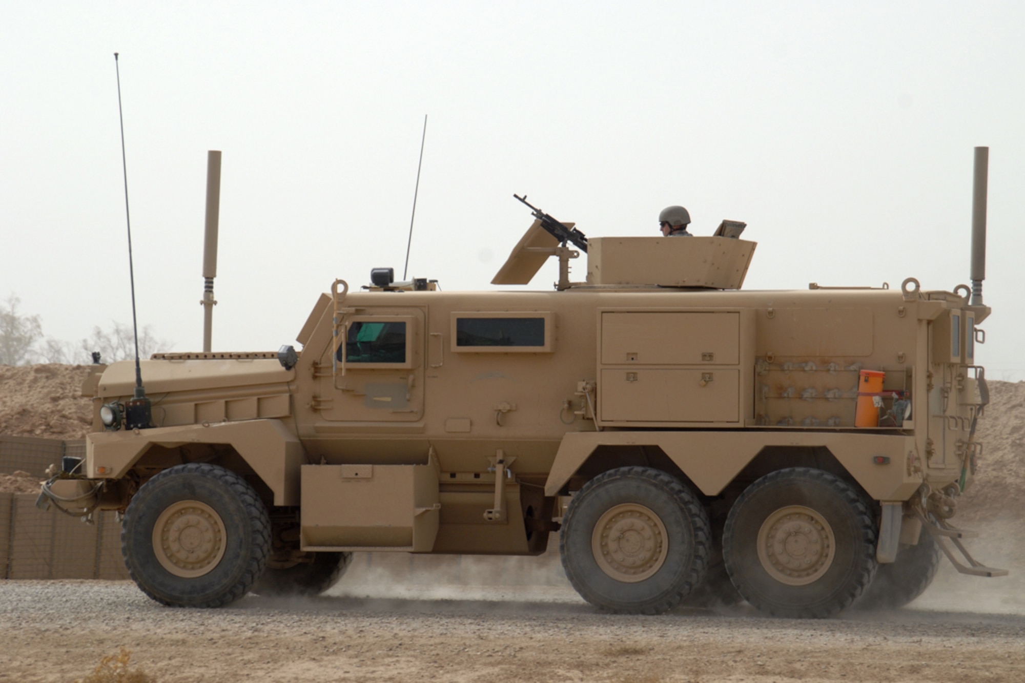 KIRKUK REGIONAL AIR BASE, Iraq - Senior Airman Aaron Skelton, 506th Air Expeditionary Group Explosive Ordnance Disposal flight journeyman, mans an M240 machine gun in the turret of a Joint EOD Rapid Response Vehicle (JERRV) Sept. 14. Airman Skelton is one of six 506th EOD Airmen forward deployed to FOB McHenry where they are embedded with soldiers of the Army's 10th Mountain Division for route clearing duties. He is deployed from Nellis Air Force Base, Nev., and calls Citrus Springs, Fla., home. (U.S. Air Force photo/Tech. Sgt. Jeff Walston)