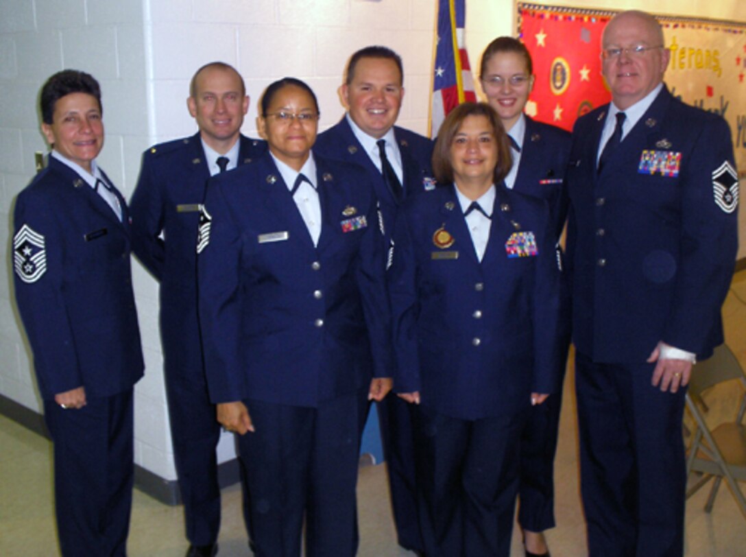 Command Chief Master Sgt. Lisa Kessinger, 2nd Lt. Michael Durbin, Master Sgt. Richard Champ, Airman 1st Class Jessica Donnelly, Senior Master Sgt. John Morrissey, 1st Sgt. Crystal Johnson and Master Sgt. Carol Walsh participated in Operation Patriotism Nov. 11 at Dardenne Elementary School in honor of Verteran's Day.  Operation Patriotism is program that teaches the audience about the history of our Flag and how it came to be what it is today. (Courtesy Photo)