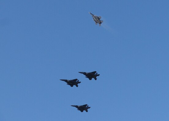Pilots from the 48th Fighter Wing performs a flyover in the missing man formation at the conclusion of the Veterans Day Ceremony held at the Cambridge American Cemetery Nov. 12, 2008, Cambridge, England. The ceremony was held to honor all servicemen and women who served in the United States military, and especially for those who paid the ultimate price while fighting for our freedom. (U.S. Air Force photo by Staff Sgt. Jerry Fleshman)