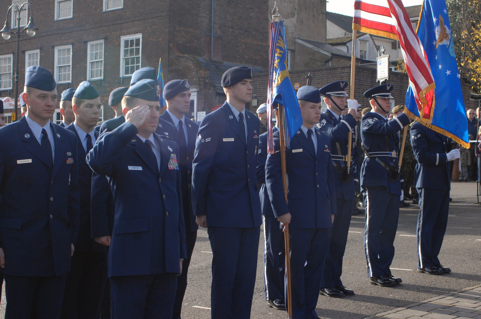 Capt. John Martin, 100th Communications Squadron Operations Flight commander, salutes during the Remembrance Day ceremony at Angel Hill, Bury St. Edmunds Nov. 9, 2008. Remembrance Day originally started to honor those who lost their lives or were injured during World War I with the tradition of wearing red poppies on civilian clothing and laying poppy wreaths at memorial sites. (U.S. Air Force photo by Senior Airman Teresa M. Hawkins)