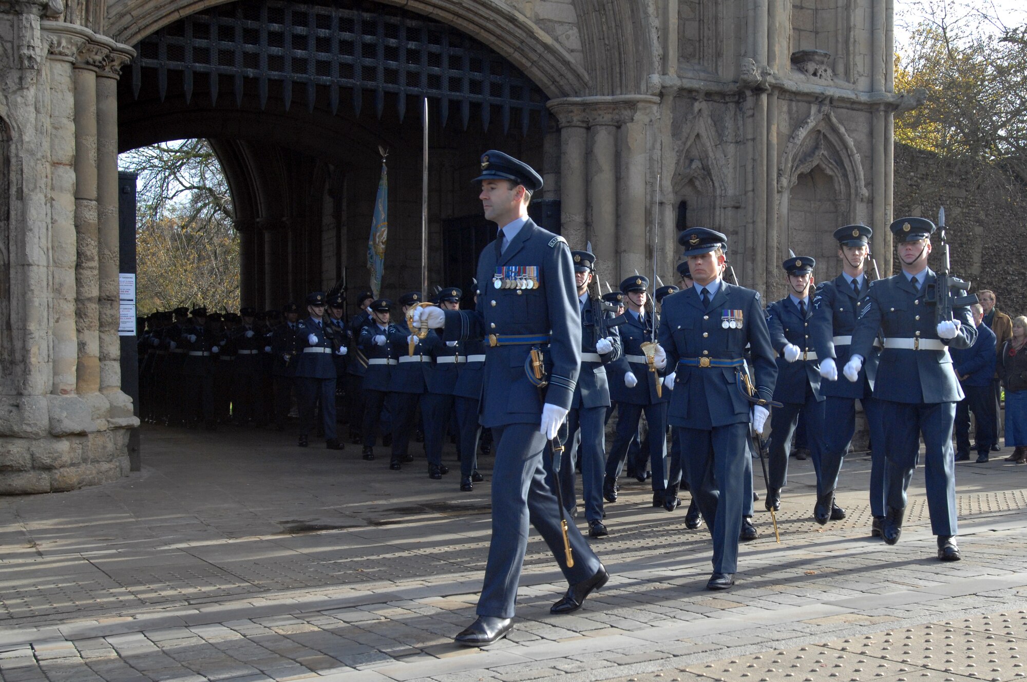 Squadron Leader 'Dutch' Holland  leads 2 Squadron Royal Air Force Regiment from RAF Honington, behind the Central Band of the Royal Air Force during the Remembrance Day ceremony held at Angel Hill, Bury St. Edmunds. Remembrance Day originally started to honor those who lost their lives or were injured during World War I with the tradition of wearing red poppies on civilian clothing and laying poppy wreaths at memorial sites. (U.S. Air Force photo by Senior Airman Teresa M. Hawkins)