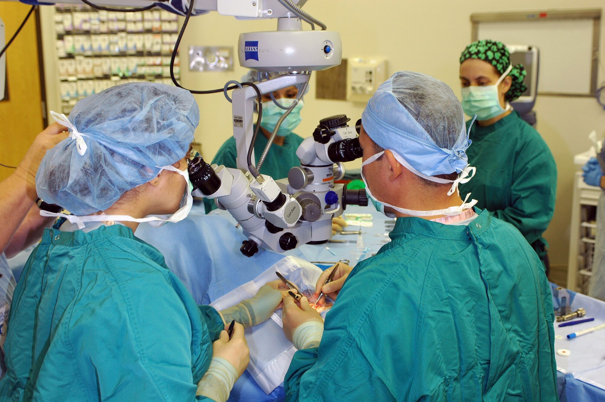 Maj. (Dr.) Vasudha Panday (left) and Lt. Col. (Dr.) Charles Reilly perform an artificial cornea transplant Oct. 20 at Lackland Air Force Base, Texas. Doctors Panday and Reilly are ophthalmologists in the 59th Surgical Specialties Squadron. (U.S. Air Force photo/Michael Sullens) 