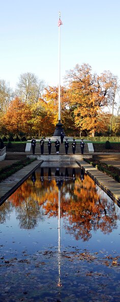 CAMBRIDGE AMERICAN CEMETERY, United Kingdom -- A combined rifle team from the RAF Alconbury Honor Guard and the JIOCEUR Honor Guard fires a volley during the Veterans Day Commemoration Nov 12,2008. Members of the United States Air Force , Army, Marines and Navy,  along with the Royal Air Force, Air Force Junior ROTC, fire and police services, American and British veterans and families of fallen service members gathered here today to honor America’s Fallen. Cambridge American Cemetery is the final resting place of 3,812 American servicemen and women who gave their lives to the cause of freedom. The the Veterans Day Commemoration is an annual event planned and organized by the 501st Combat Support Wing headquartered at RAF Alconbury United Kingdom.(U.S. Air Force photo by Staff Sgt. Chad E. Chisholm) 

