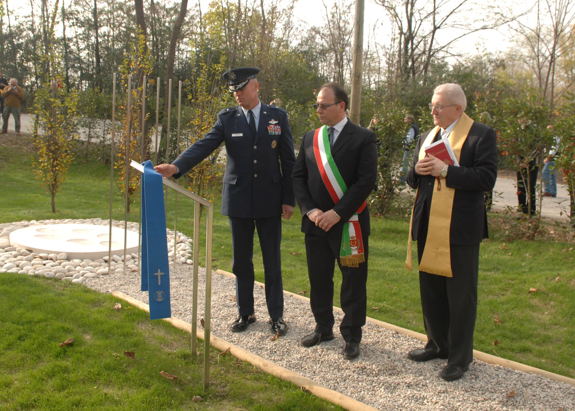 Brig. Gen. Craig Franklin, 31st Fighter Wing commander; Santa Lucia di Piave Mayor Fiorenzo Fantinel and Roman Catholic Priest don Italo Moras reflect at the memorial ceremony of the UH-60 Helicopter crash that happened in Santa Lucia di Piave, Italy, on Nov. 8, 2007. Family members, survivors and community members gathered to commemorate the one year anniversary of the crash on Nov. 8 in the city.  (U.S. Air Force photo/Senior Airman Taylor Marr)