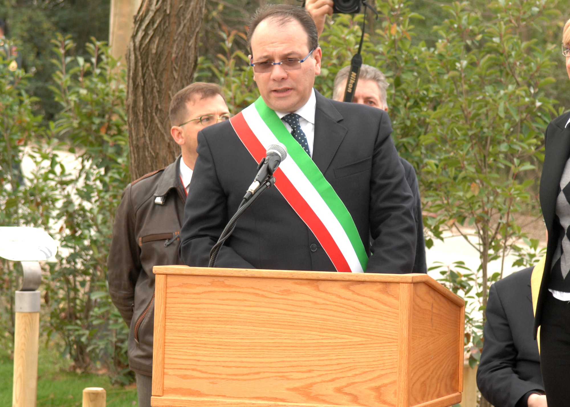 Santa Lucia di Piave Mayor Fiorenzo Fantinel addresses those gathered at the UH-60 Helicopter crash memorial ceremony on Nov. 8. The memorial honors the six U.S. military members who lost their lives in the helicopter crash one year ago as well as the thousands of Italians who lost their lives in the Piave River during World War I. (U.S. Air Force photo/Senior Airman Taylor Marr)