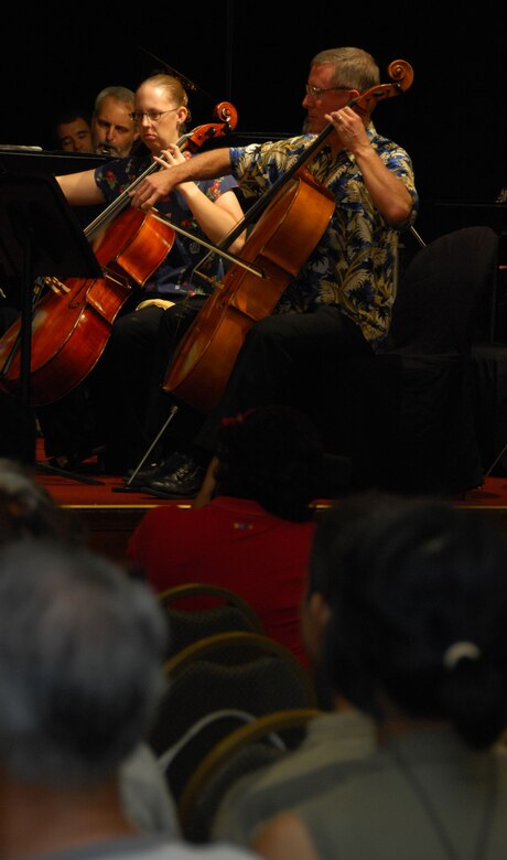 ANDERSEN AIR FORCE BASE, Guam - Captain April Bowman (left), 554th RED HORSE Squadron lead engineer, performs "Stars and Stripes Forever," with members of the Guam Symphony Society Nov. 11 at the Guam Hilton Resort and Spa. Captain Bowman learned to play the cello when she was 10 years old. She has been a member of the Guam Symphony Society since November 2007. (U.S. Air Force photo by Senior Airman Shane Dunaway)