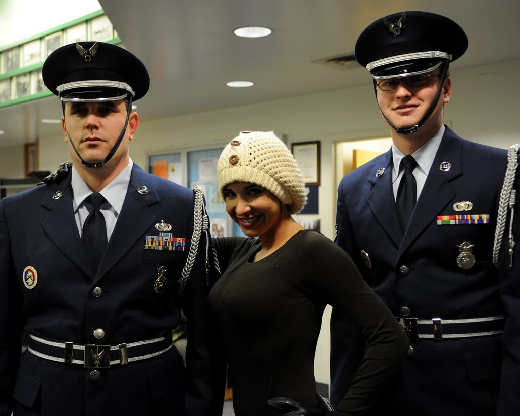 Model Mayra Veronica poses for a photo with 213th Space Warning Squadron members U.S. Air Force Tech. Sgt. Charles Forquer, left, and Senior Airman Christopher Williams during a visit to Clear Air Force Station, Alaska, Nov. 10, 2008. Veronica is part of a USO tour accompanying Vice Chairman of the Joint Chiefs of Staff U.S. Marine Gen. James E. Cartwright.