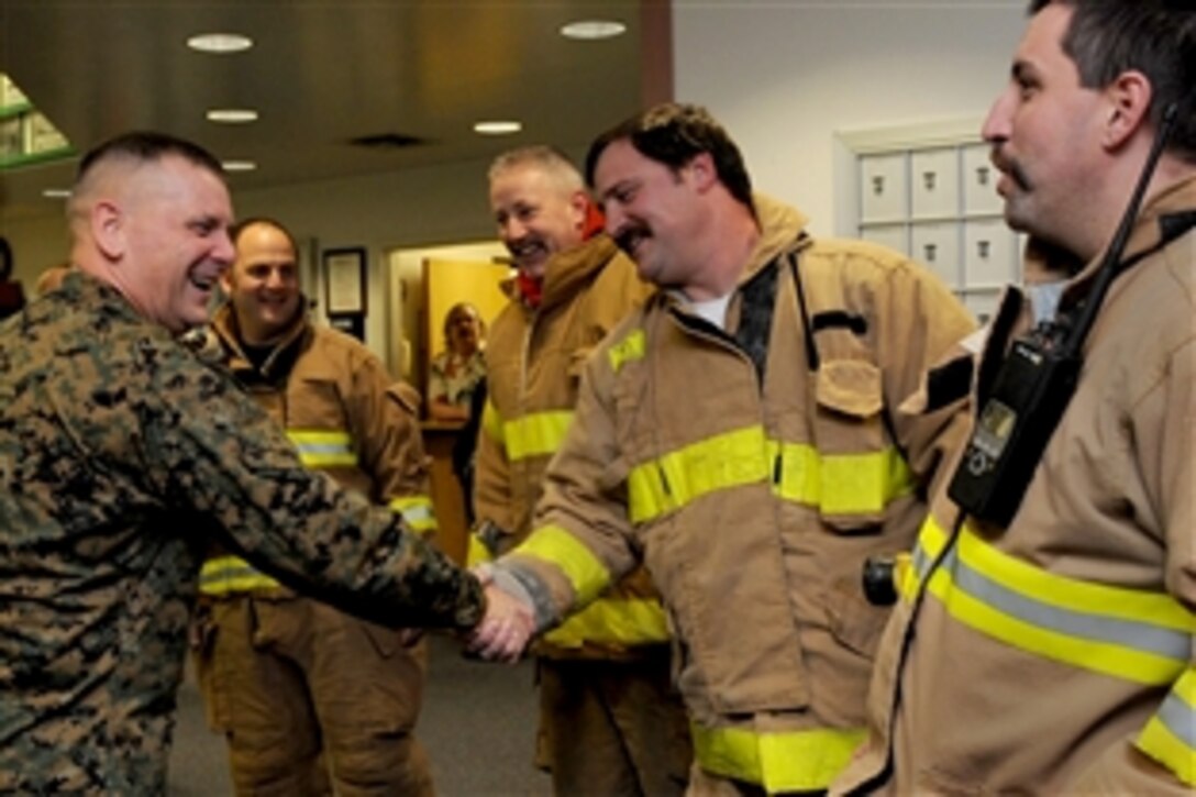 Vice Chairman of the Joint Chiefs of Staff U.S. Marine Gen. James E. Cartwright meets with firefighters during a visit to Clear Air Force Station, Alaska, Nov. 10, 2008. Cartwright is on an eight-day, five-country visit to see troops. 