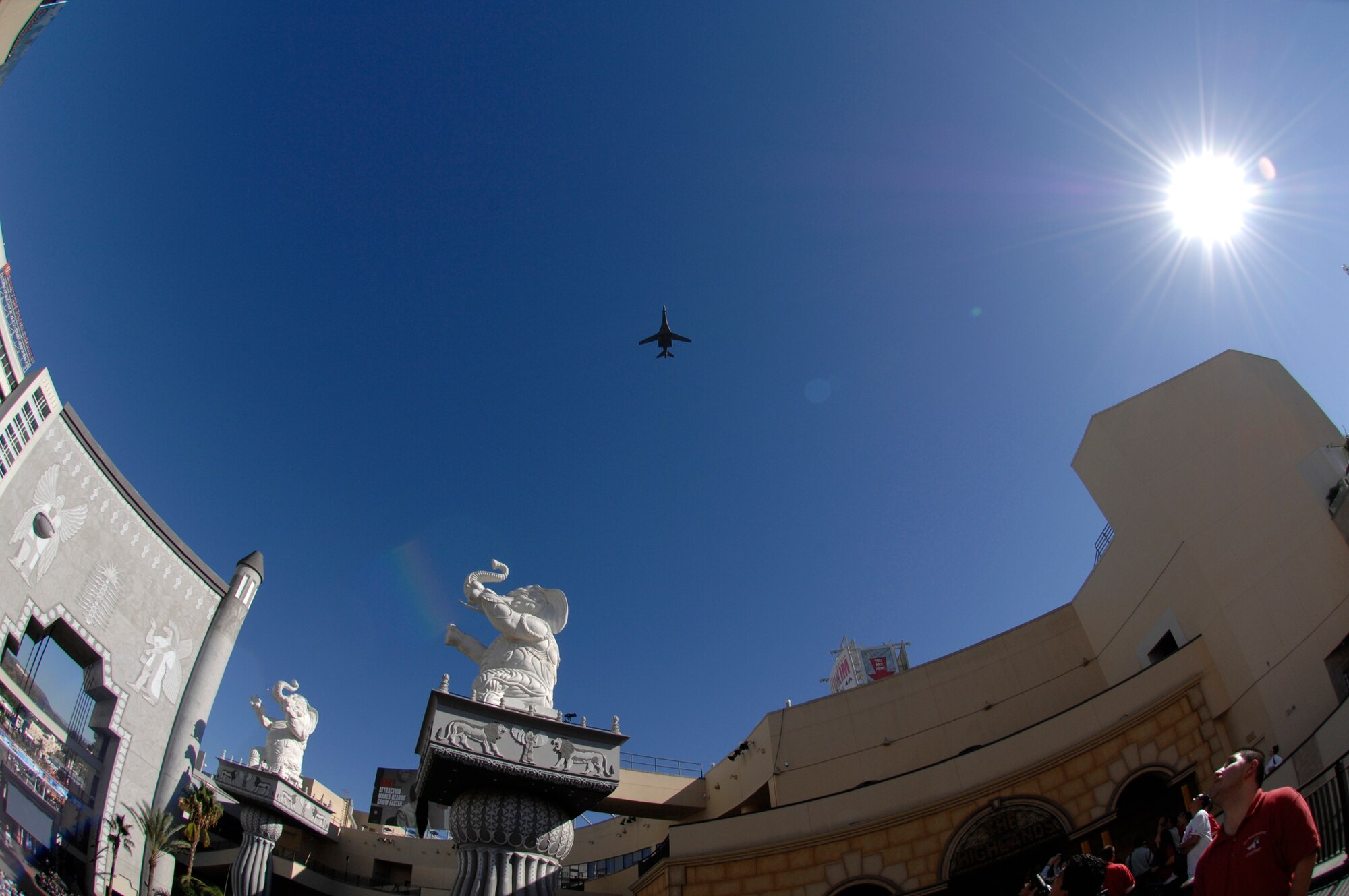 A B-1 Lancer flies over the Hollywood & Highland Center to kickoff Air Force Week in Los Angeles, Nov. 14. (Photo by Joe Juarez)