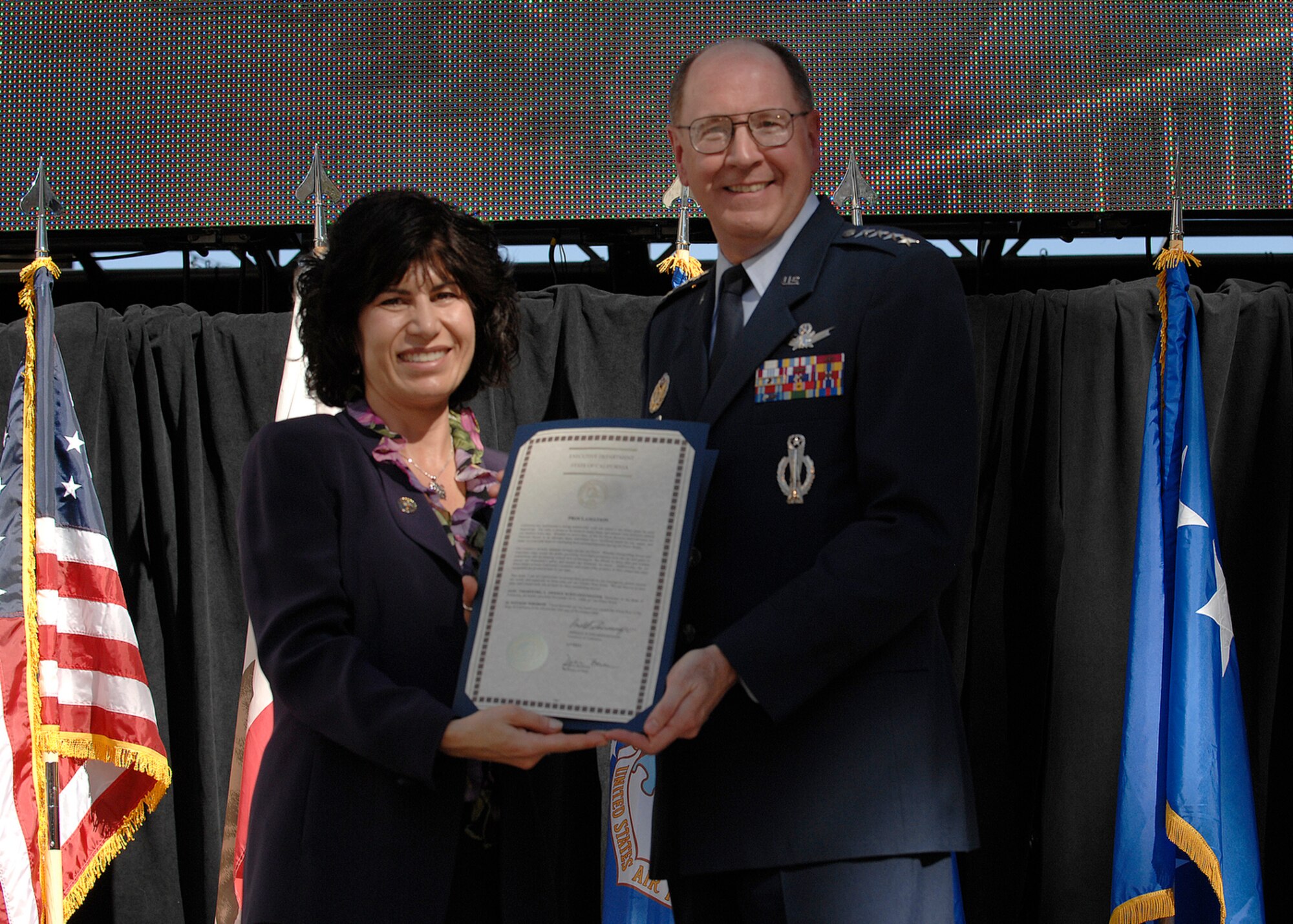 Gen. C. Robert "Bob" Kehler accepts the proclamation for Air Force Week-Los Angeles on Nov. 14 at the Hollywood and Highland Plaza in Los Angeles. The proclamation was signed by Gov. Arnold Schwarzenegger and presented by Lisa Kalustian, chief deputy director of the office of the governor. The ceremonies include performances by the Air Force Honor Guard Drill Team and the Air Force Band of the Golden West with flyovers by several different Air Force aircraft and interactive expos. Air Force Week-Los Angeles continues until Nov. 21 and has events throughout the area. Gen. Kehler is the Air Force Space Command commander from Peterson Air Force Base, Colo. (U.S. Air Force photo/Staff Sgt. Bennie J. Davis III) 